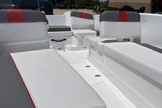 2026 Tahoe T16 boat interior with white and gray seating, red accents.