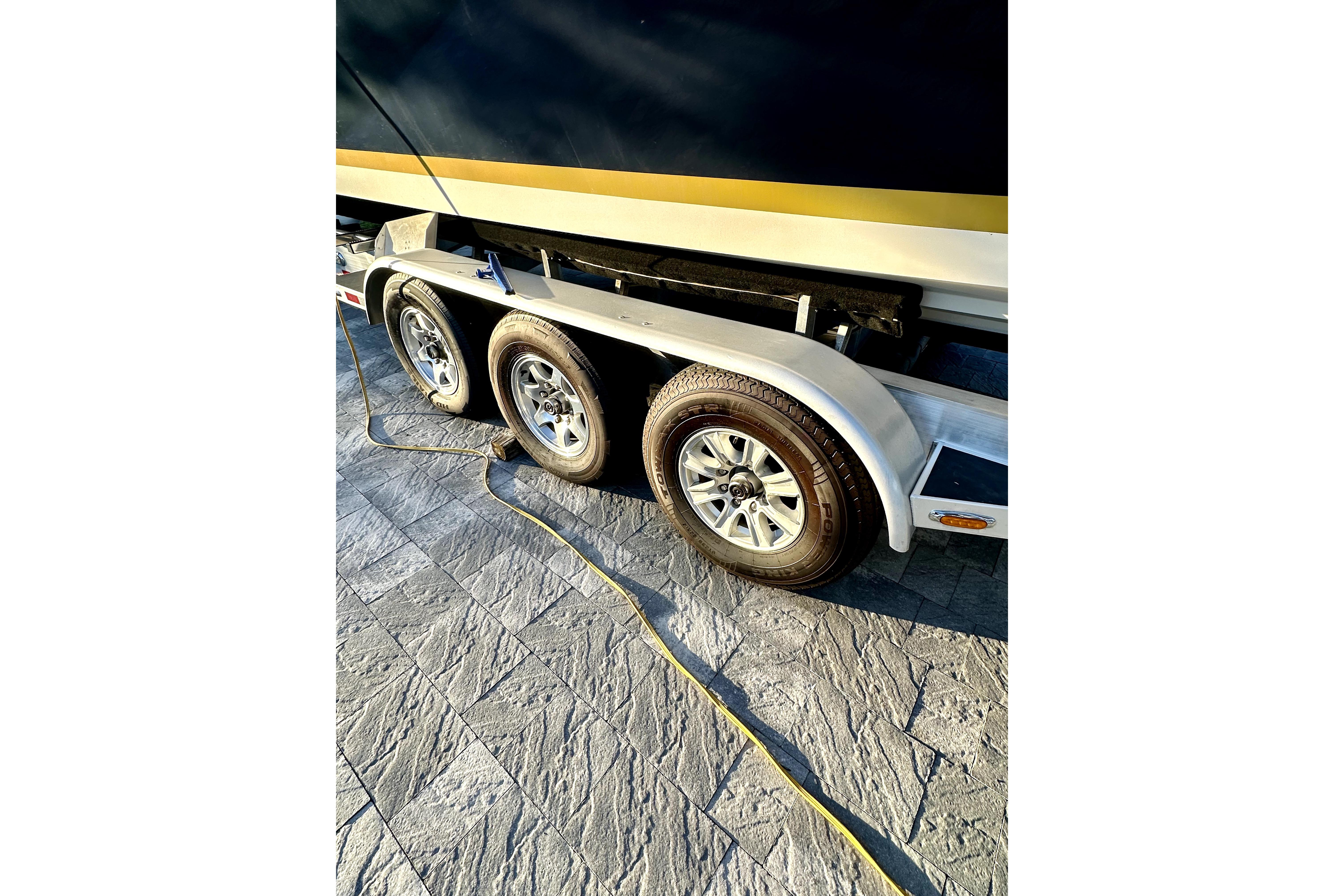 Trailer with triple axles for 2006 Contender 35 Express Side Console boat.