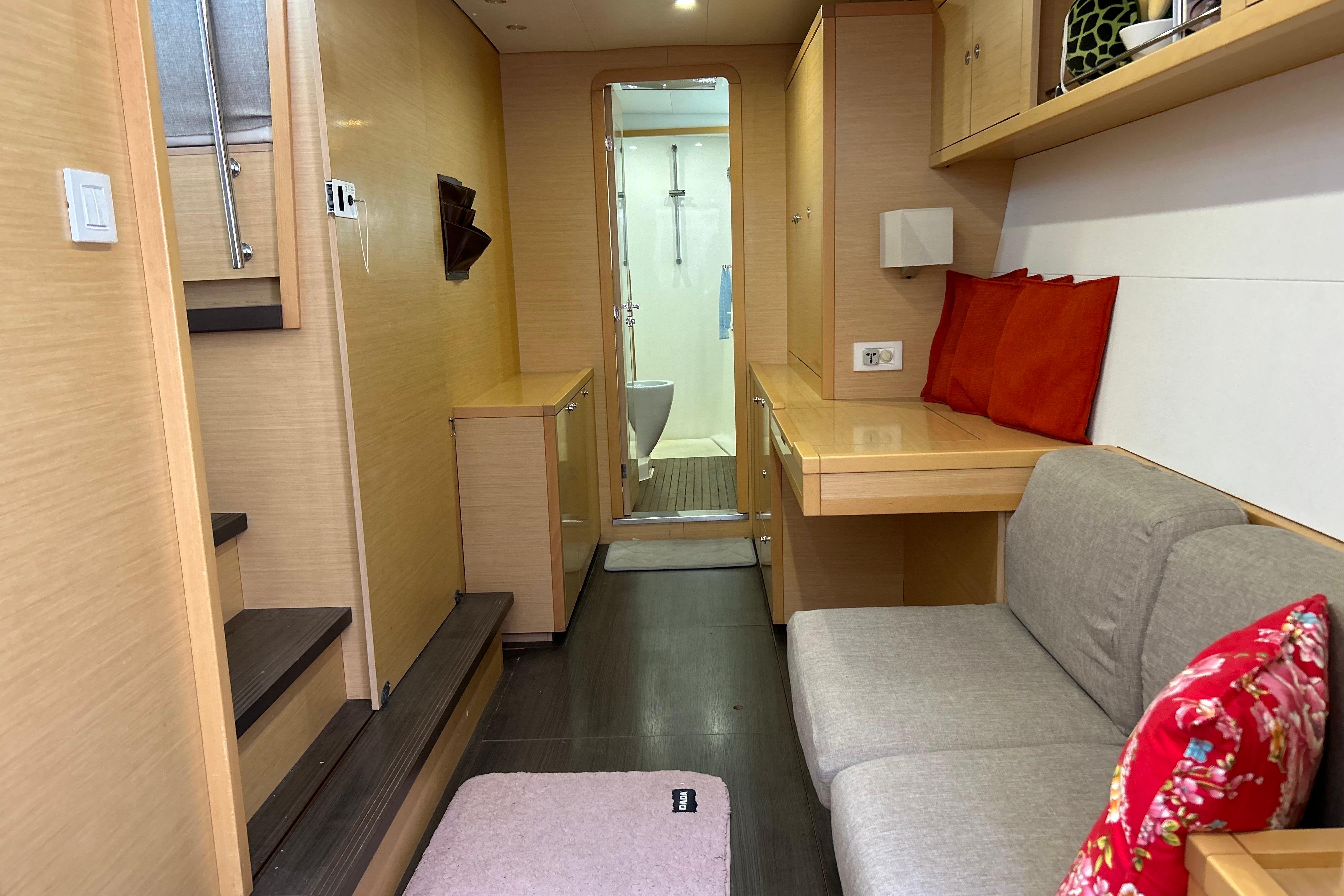 Interior of 2012 Lagoon 450 F yacht, featuring cozy seating and modern design.