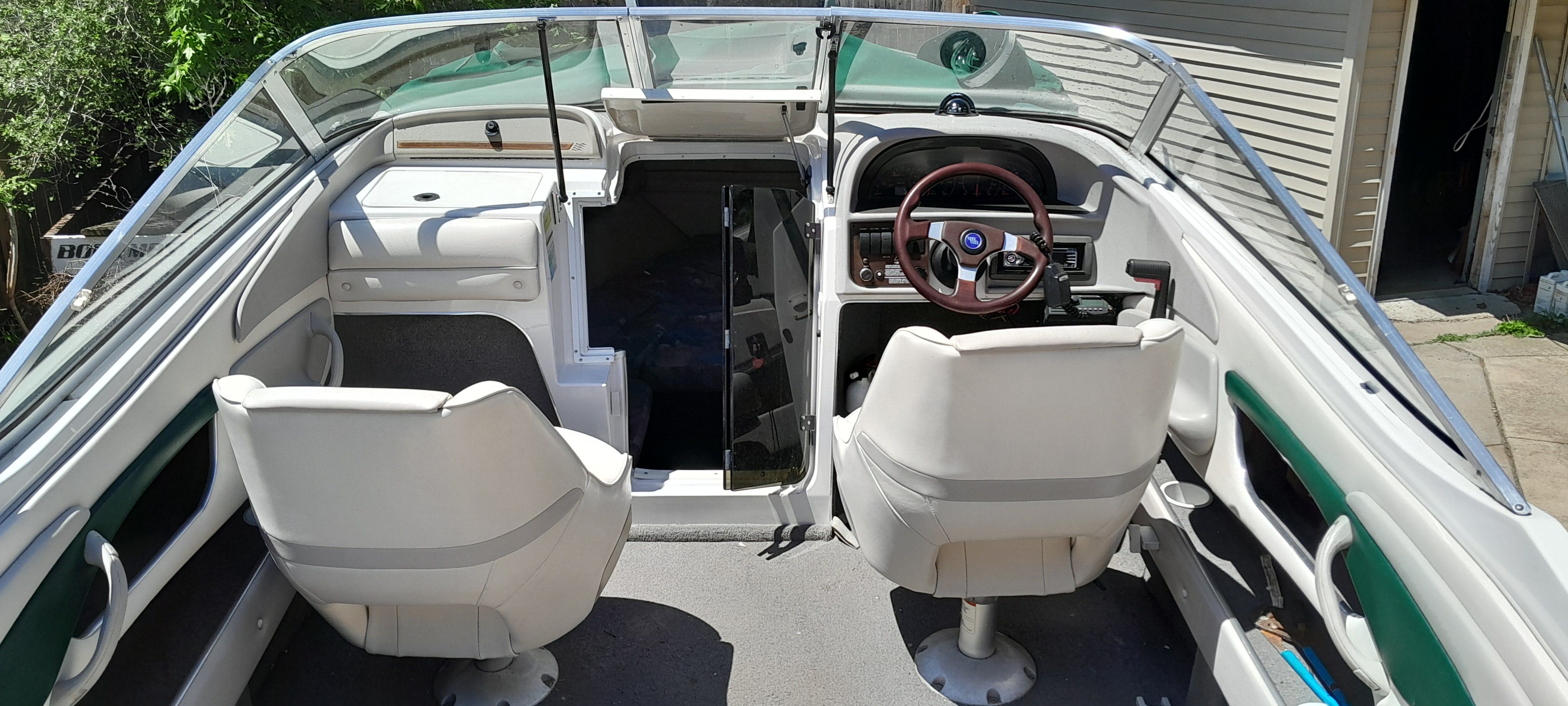 Interior of a 1995 Four Winns 205 Sundowner boat with two seats.