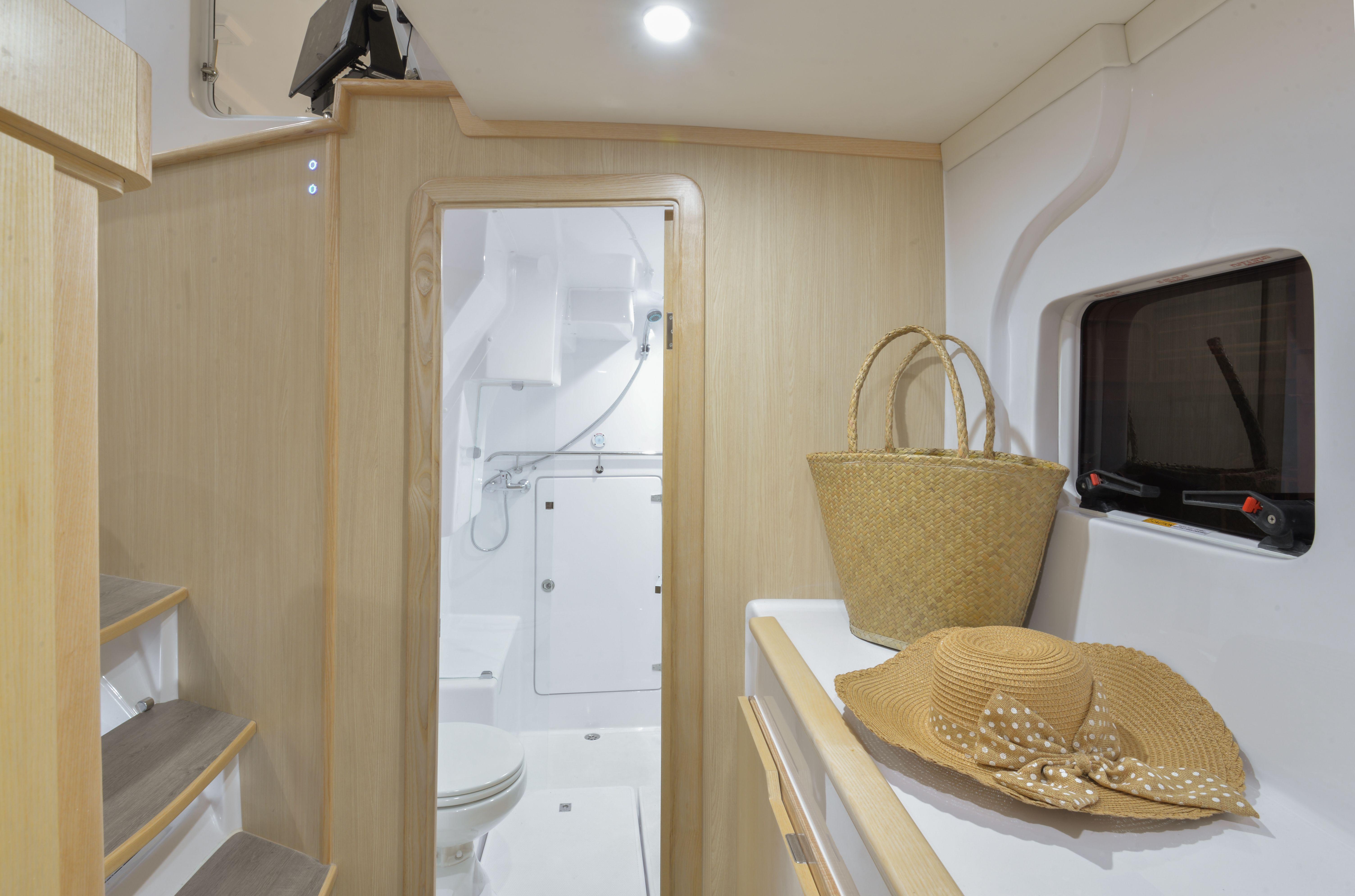 Interior of 2025 Seawind 1170 yacht with bathroom, stairs, and accessories.
