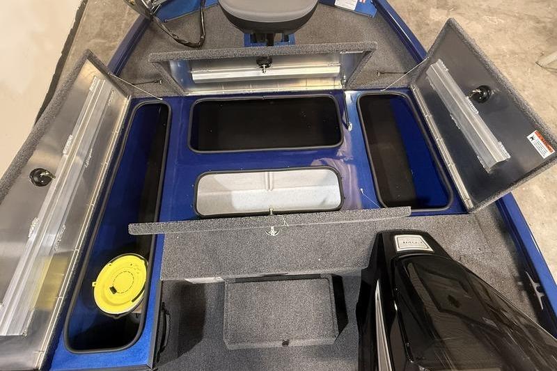 2026 Lowe Stinger 175C boat interior with open storage compartments and seating.