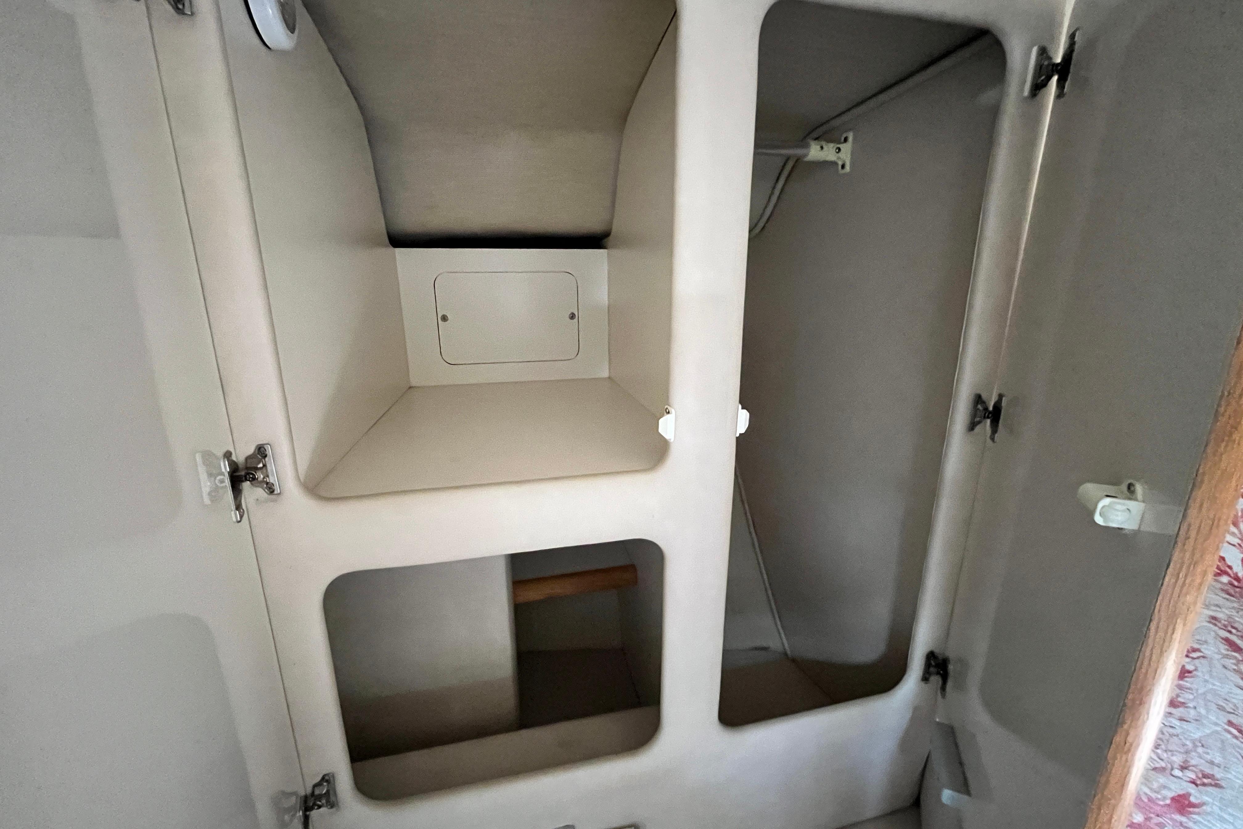 Interior storage compartments of a 1995 Sea Ray Sundancer 330 boat.