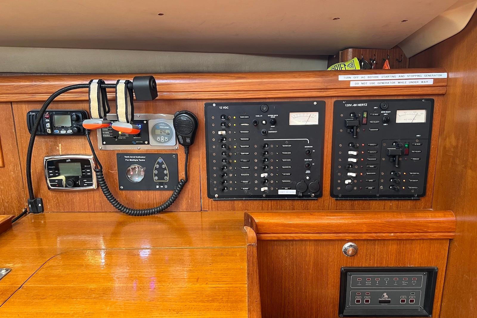 Control panel of a 2005 Hunter 44 Deck Salon sailboat, featuring navigation and communication equipment.