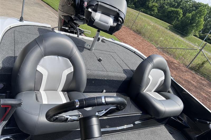 2026 Nitro Z17 boat interior with gray seats and steering wheel.