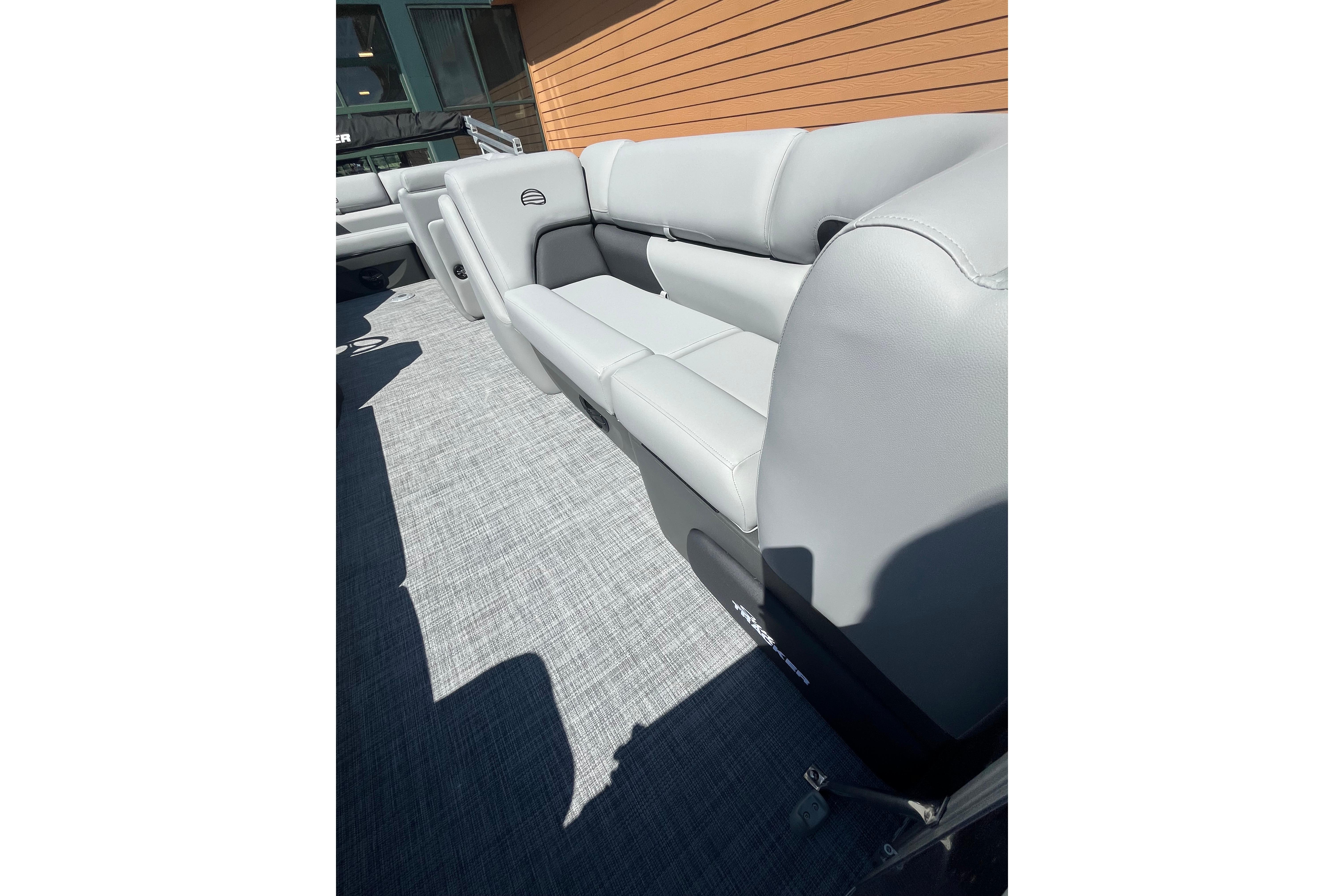 2026 Sun Tracker Party Barge 20 DLX with sleek gray seating and modern design.