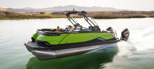 2024 Godfrey XP 27' boat with twin 400HP engines cruising on a scenic river.