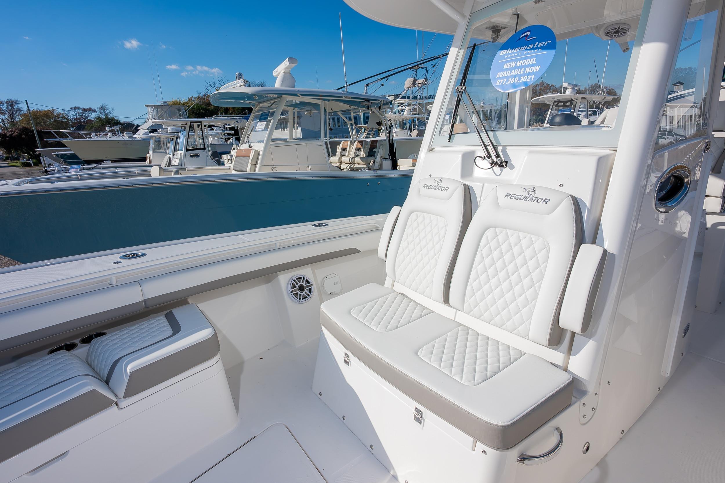 2026 Regulator 28 boat interior with white seating and modern design.