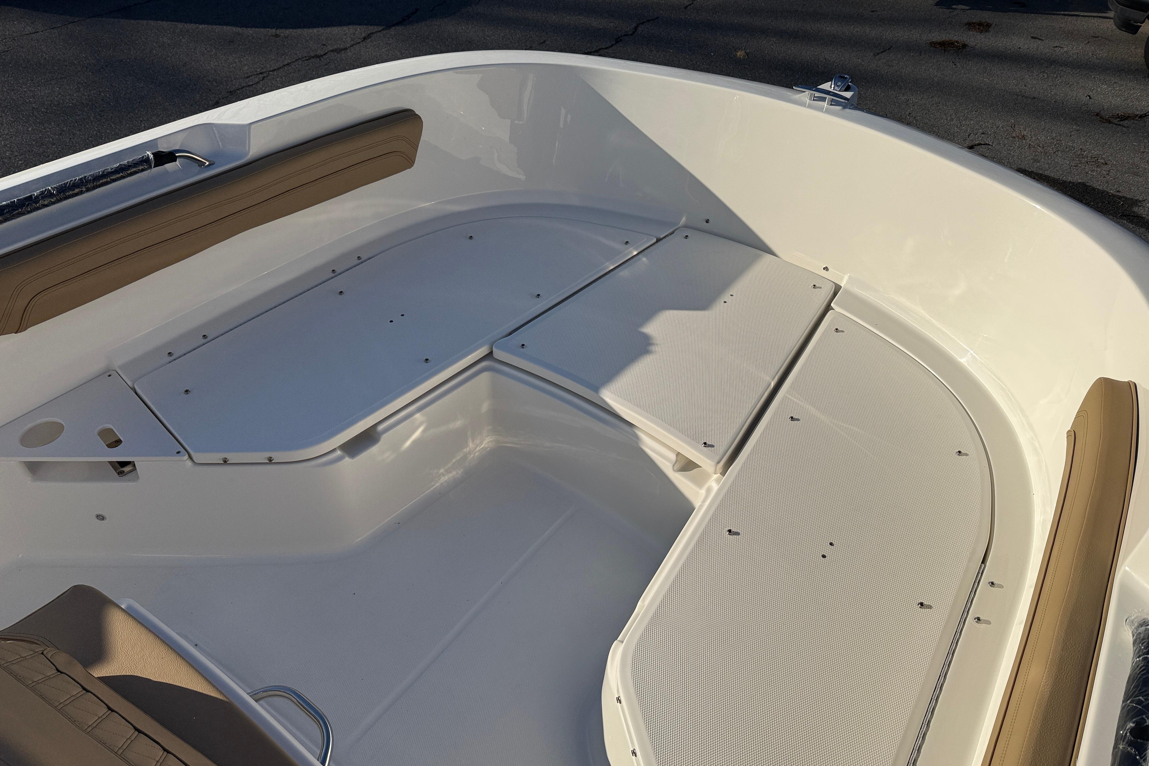 2026 Bayliner Trophy T22CC boat interior with cushioned seating and storage compartments.