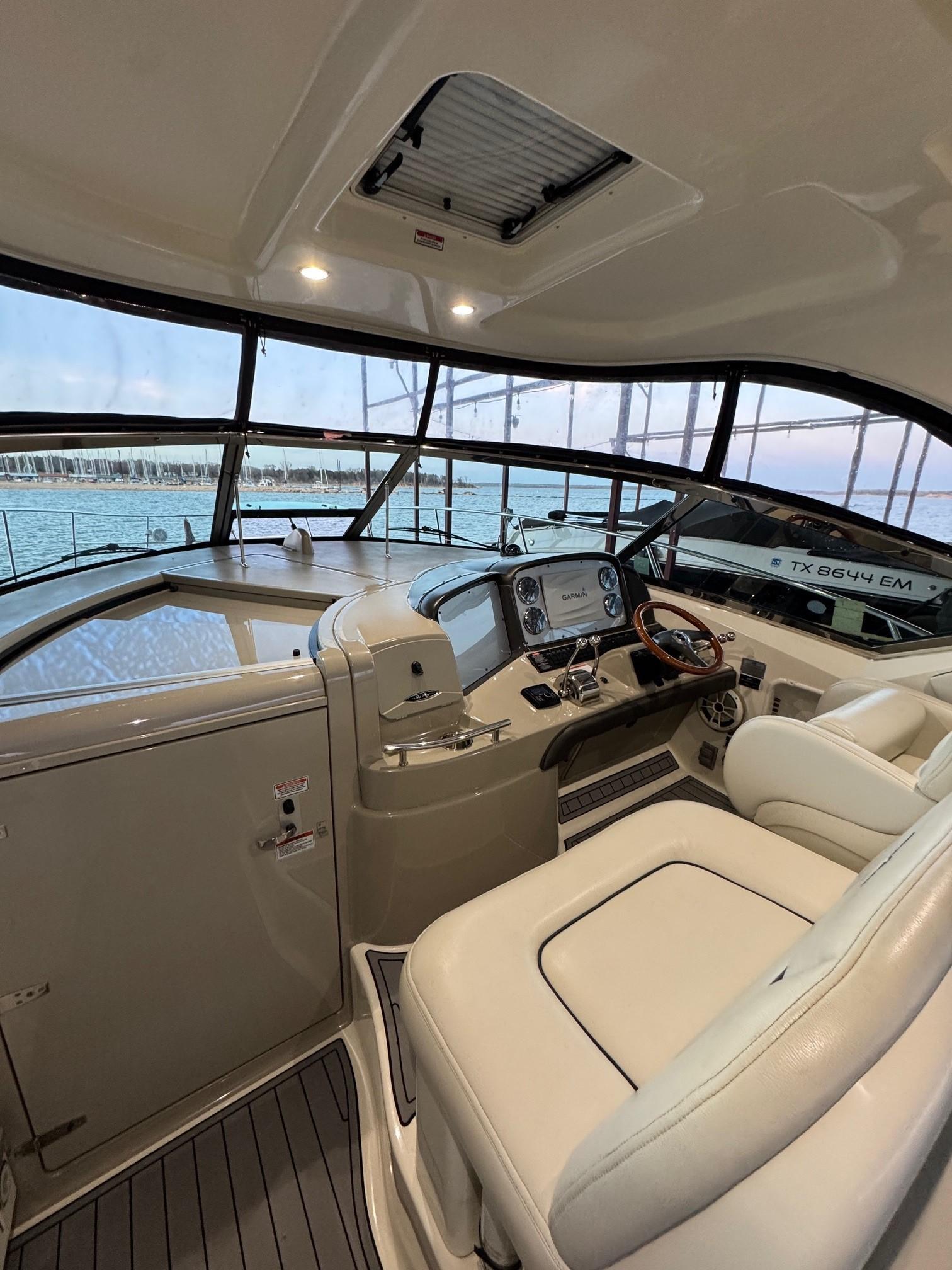 2007 Sea Ray 38 Sundancer helm with luxurious seating and panoramic water views.