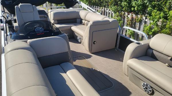 2023 Sun Tracker SportFish 22 XP3 pontoon boat with spacious seating and modern design.