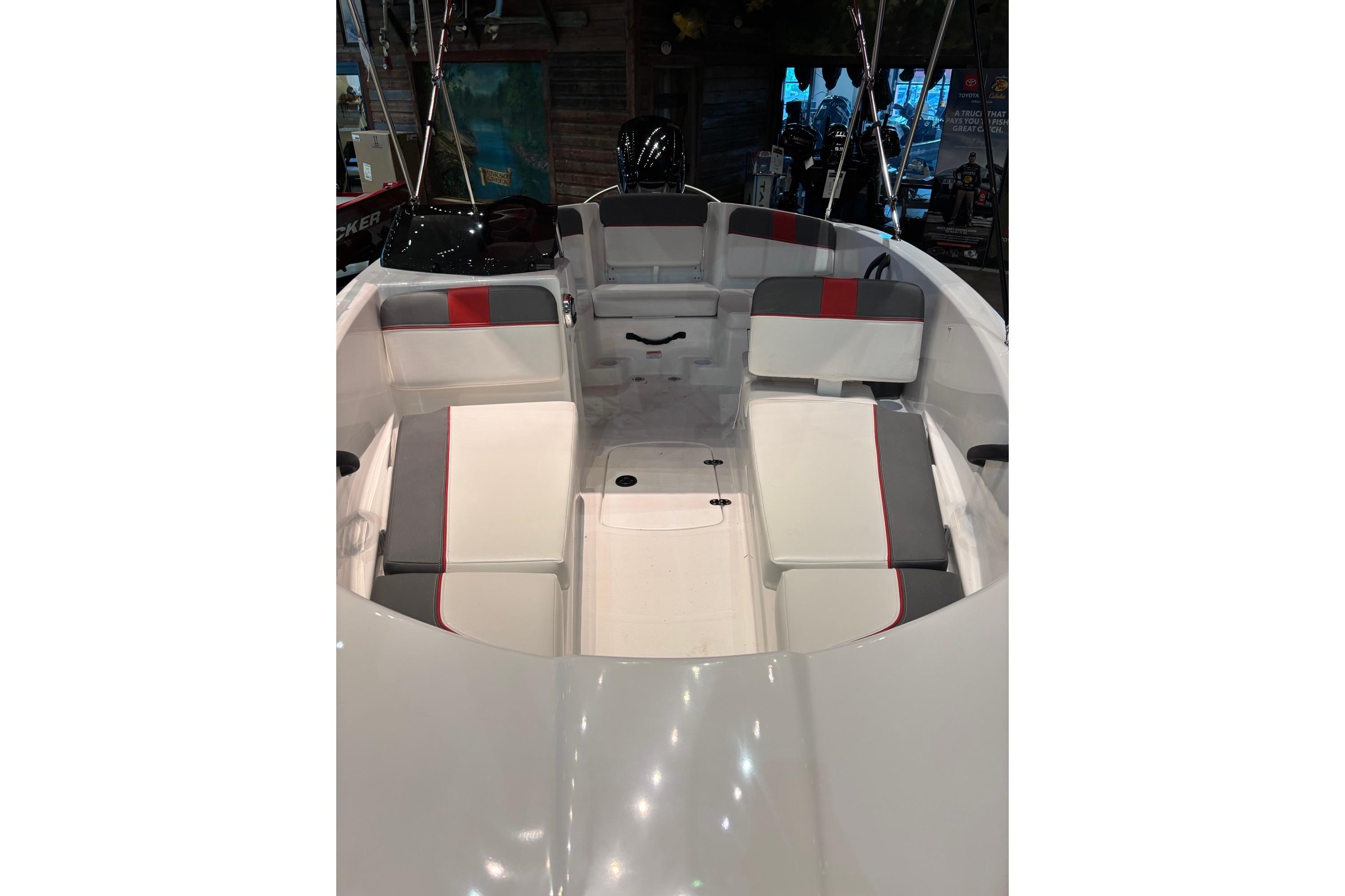 2026 Tahoe T16 boat interior with white and gray seating, red accents.