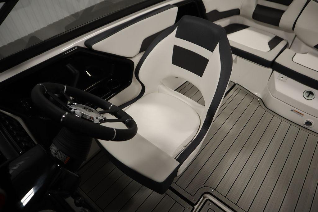 Interior of 2026 Yamaha Boats 195S, featuring sleek seating and modern steering wheel design.