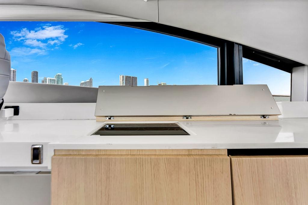 Interior view of 2012 Fairline Targa 58 yacht with city skyline through window.