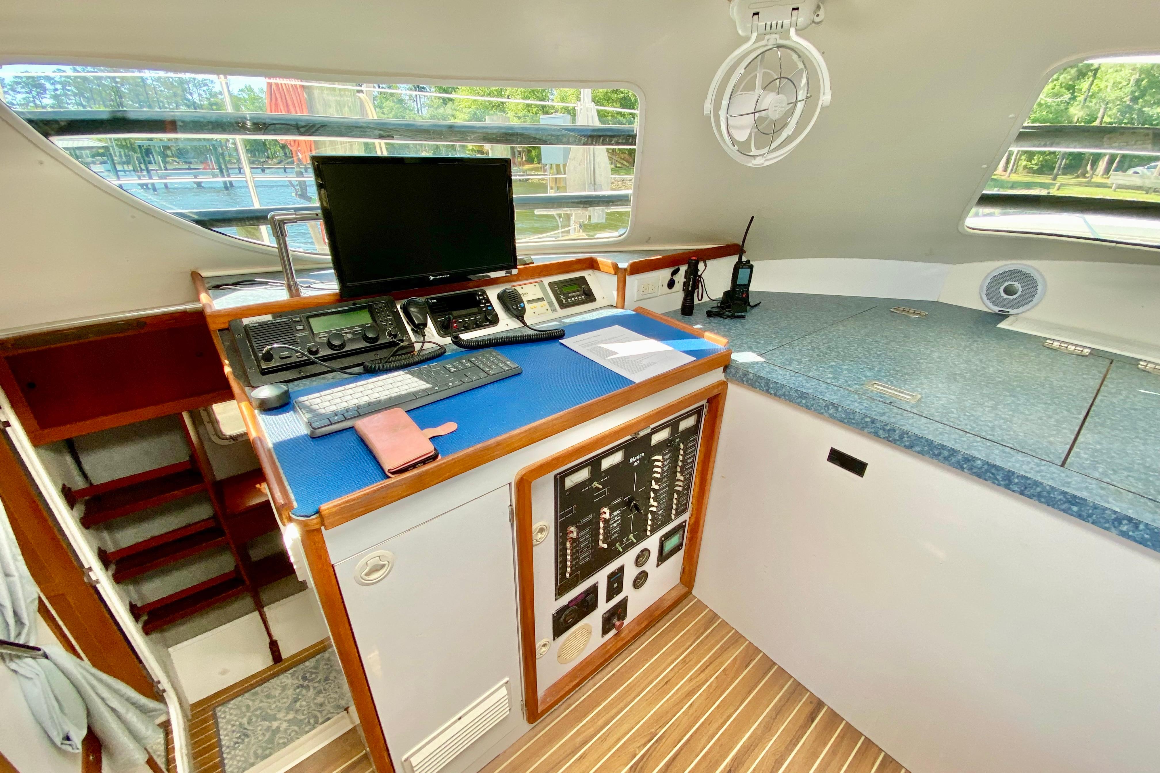 Navigation station of a 1998 Manta 40 yacht with control panel and equipment.