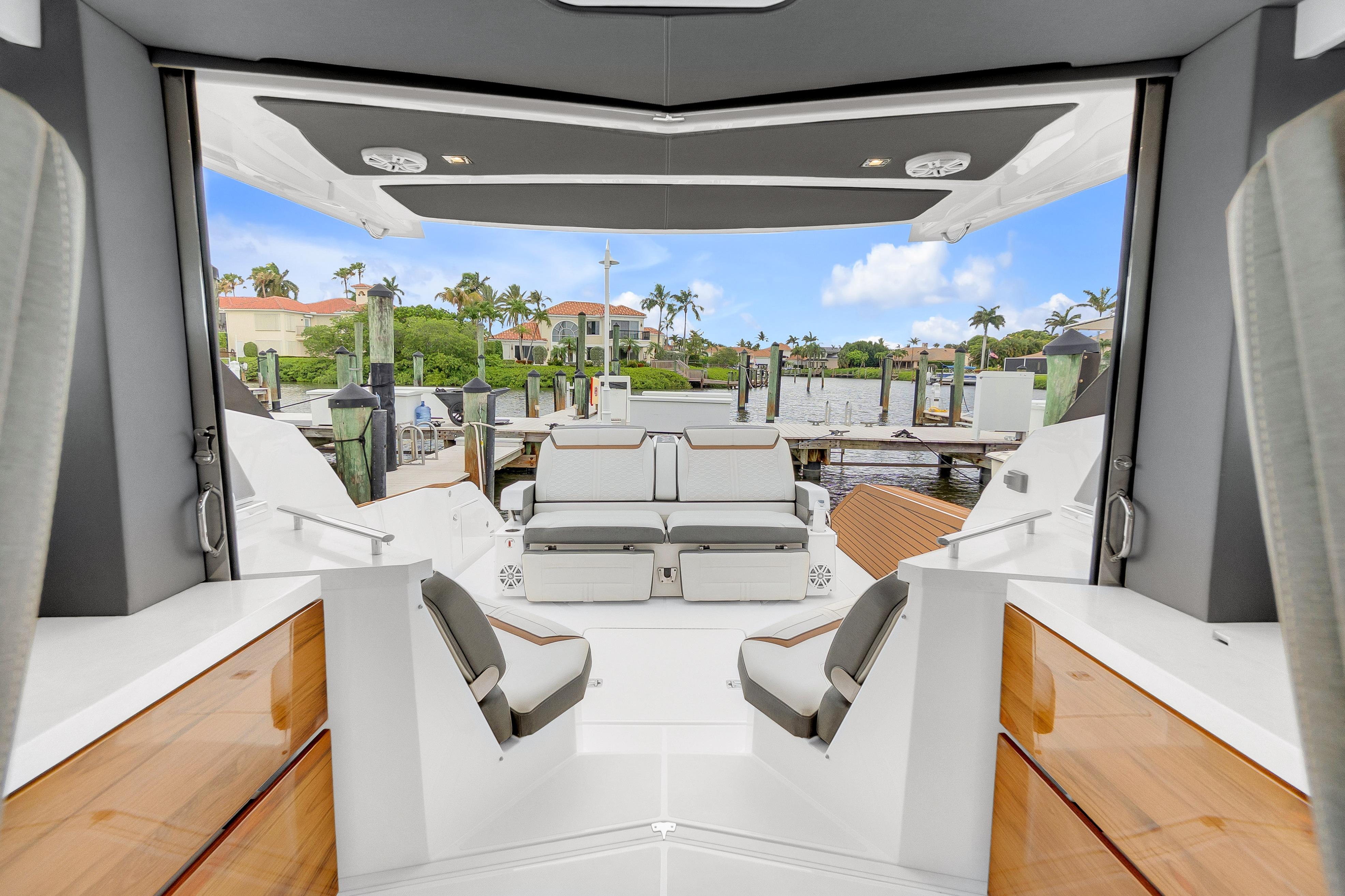 Interior view of 2021 Tiara Sport 43 LE yacht at a marina.