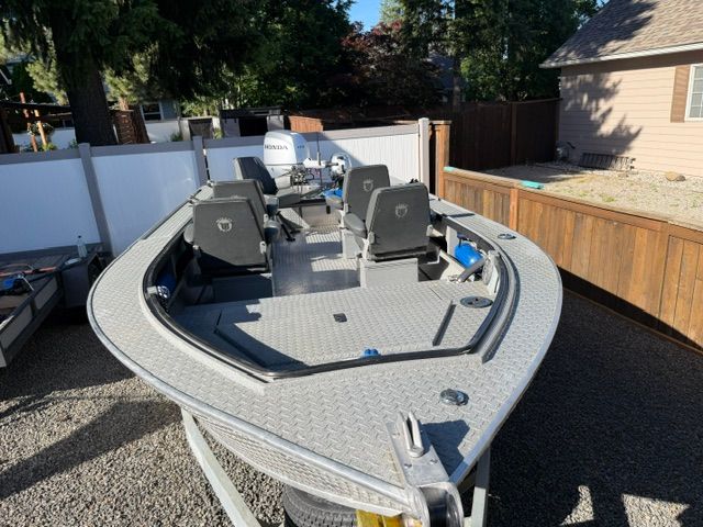 2008 Willie Boats Predator parked in a yard.