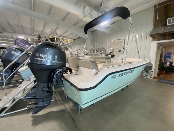 2024 Key West 189 FS boat with Yamaha outboard motor in showroom.