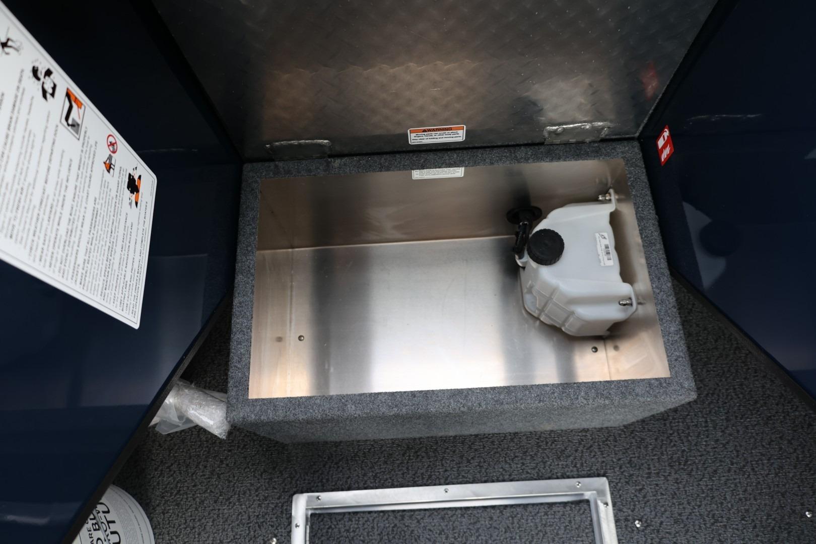 Storage compartment in 2026 Thunder Jet 24 Alexis Pro boat, featuring a secure container.