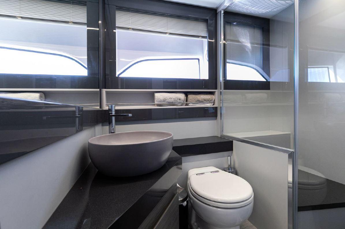 Luxurious bathroom in 2018 Pershing 5x yacht with modern fixtures and sleek design.