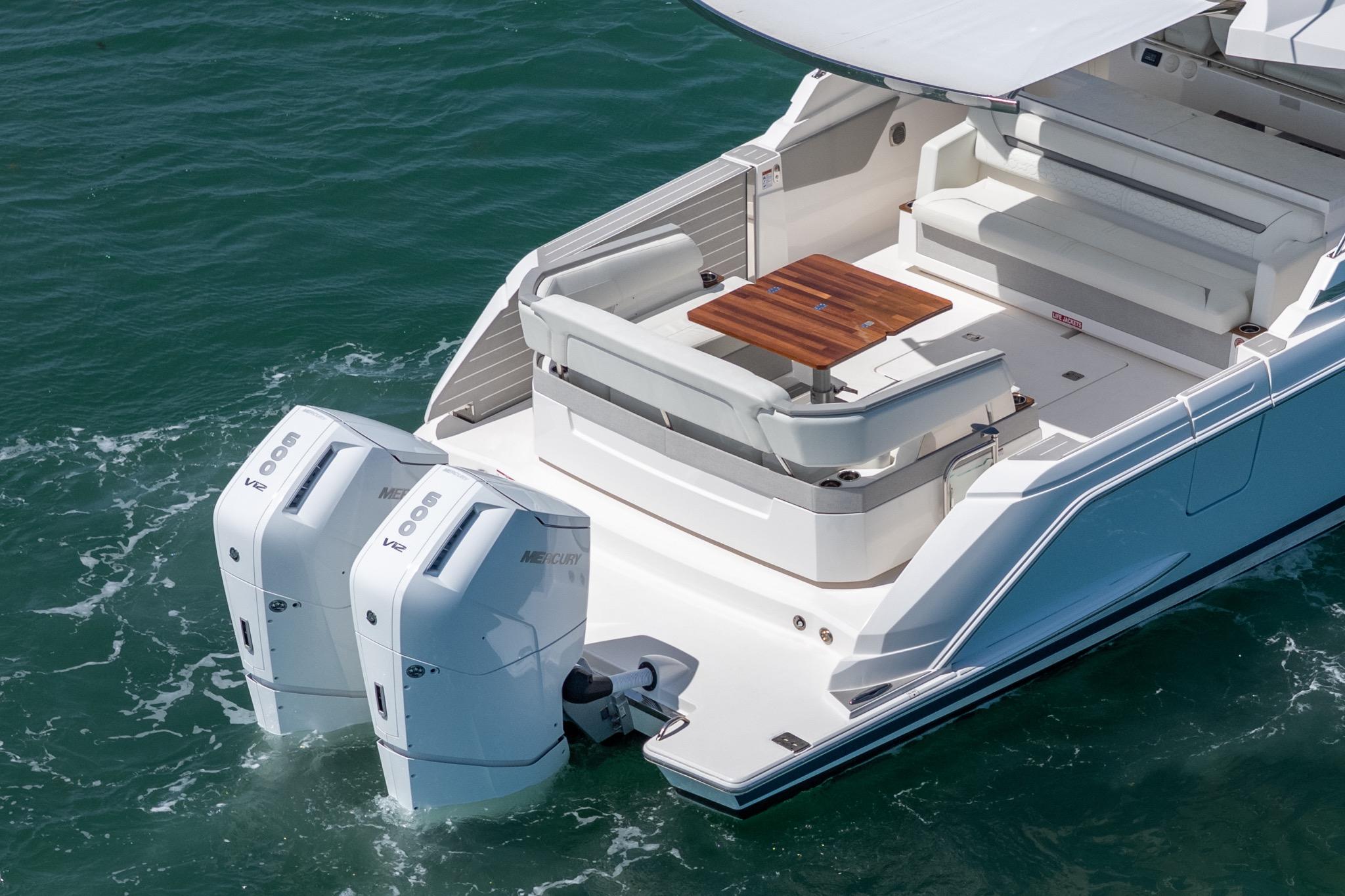 2024 Tiara Yachts 43 LS with dual Mercury outboard engines, featuring a spacious deck and seating area.