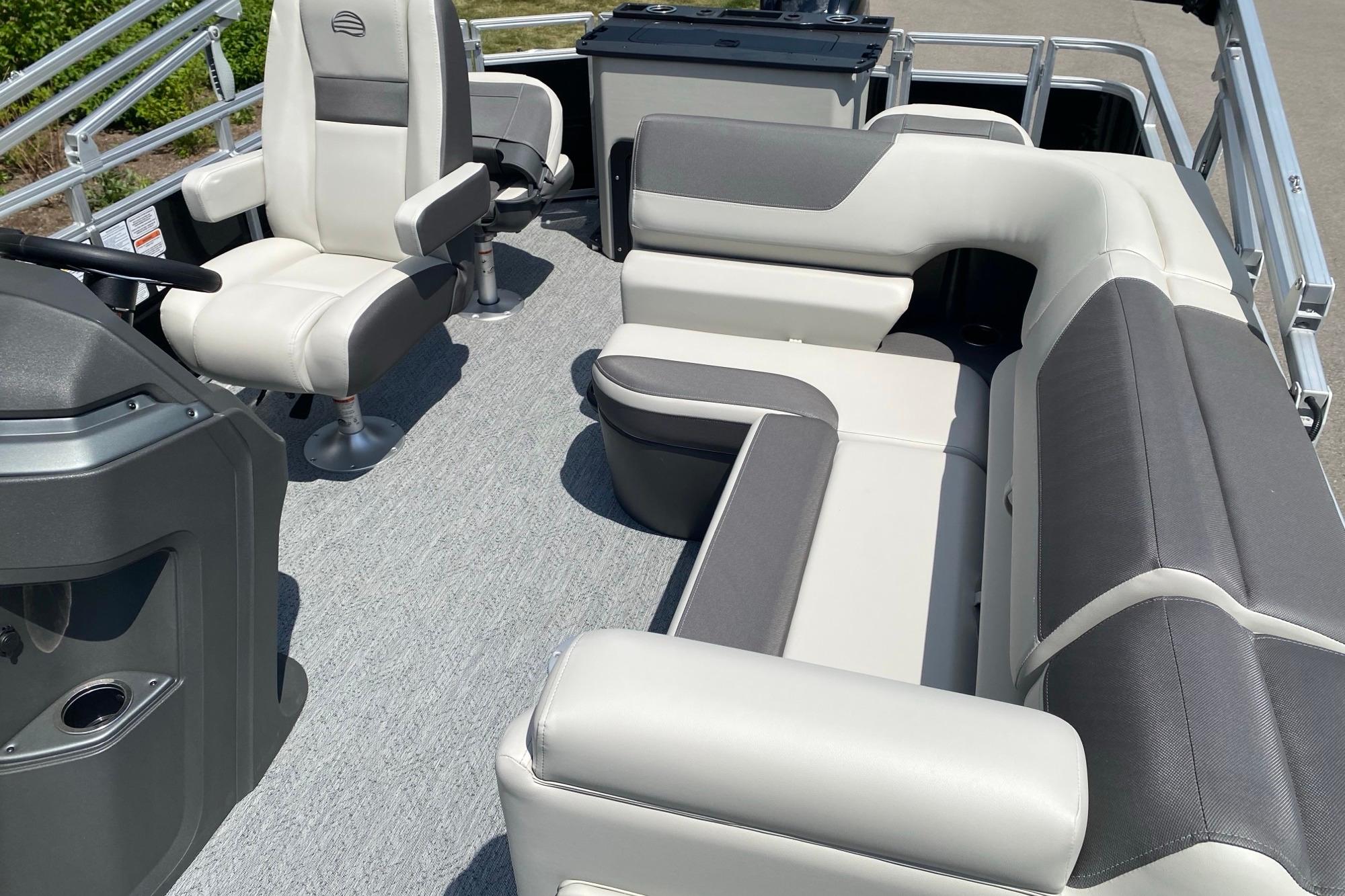 2026 Sun Tracker Fishin' Barge 20 DLX interior with plush seating and modern design.
