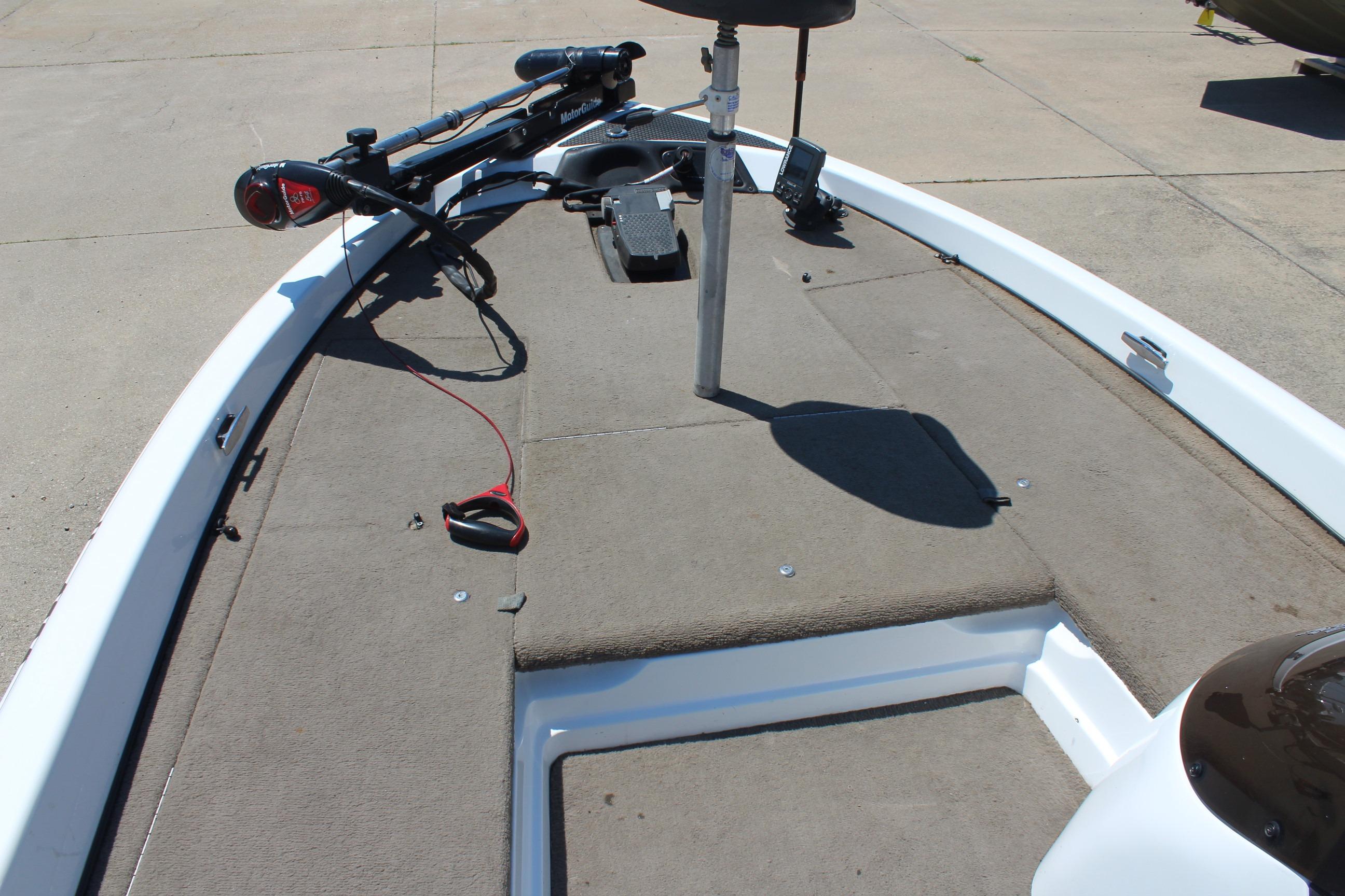 2003 Nitro NX 750 SC boat deck with trolling motor and carpeted surface.