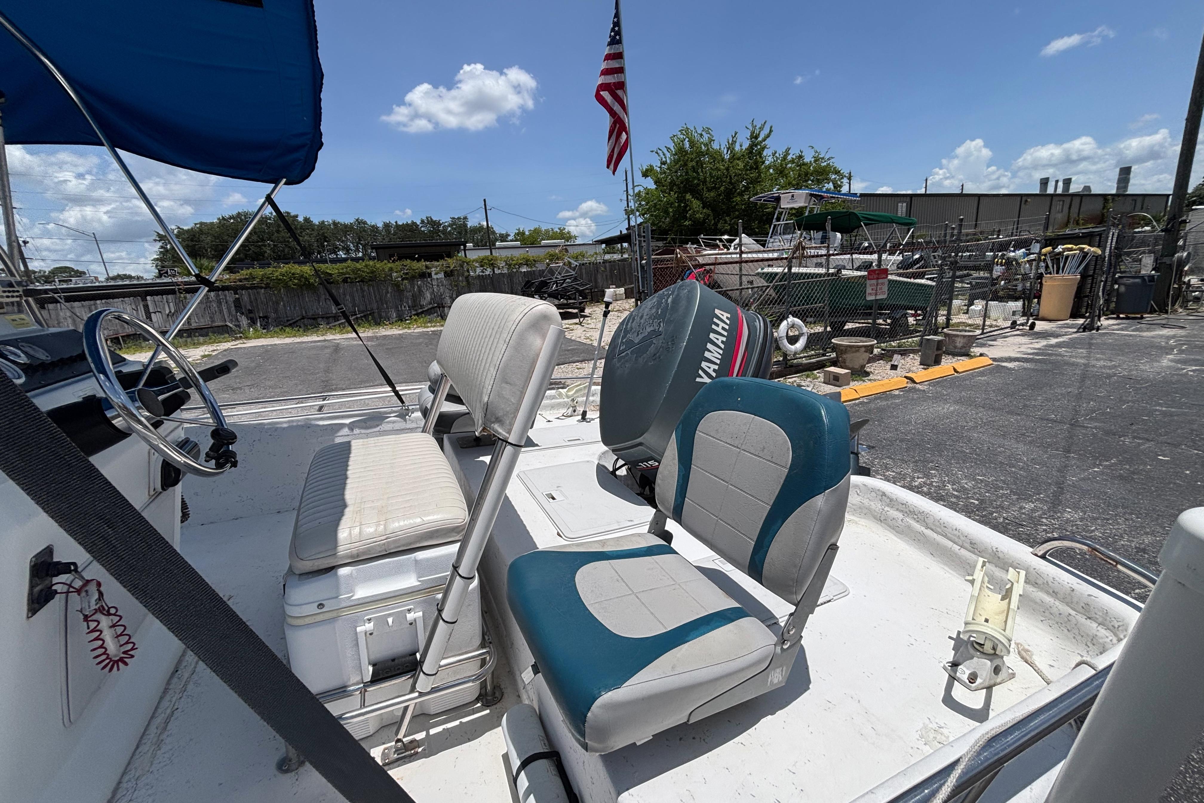 2000 VIP 1880 BAY STEALTH boat with Yamaha motor, featuring comfortable seating and steering wheel.