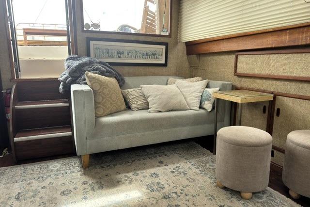 Cozy interior of a 1980 Viking 43 Convertible yacht with sofa and decor.