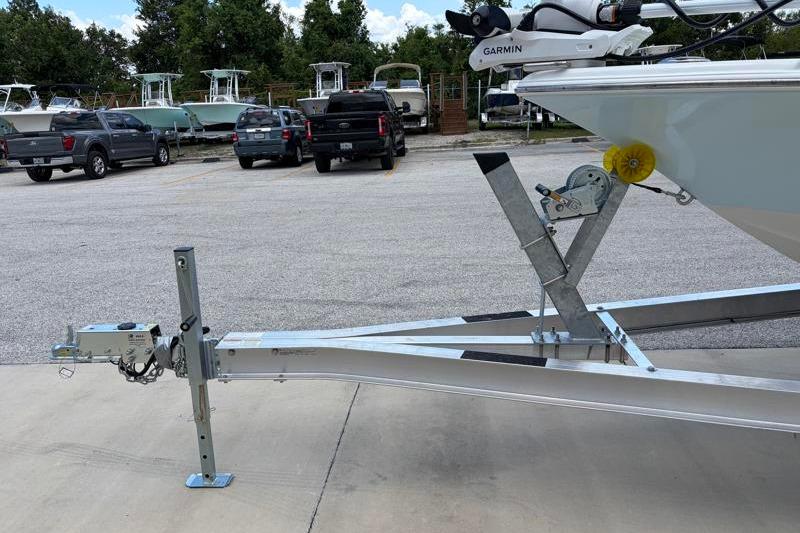 2025 Key West 210 Bay Reef boat on trailer in parking lot.