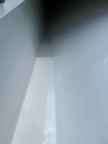 Close-up of a 2022 Yellowfin 39 Offshore boat interior, showcasing sleek white surfaces.