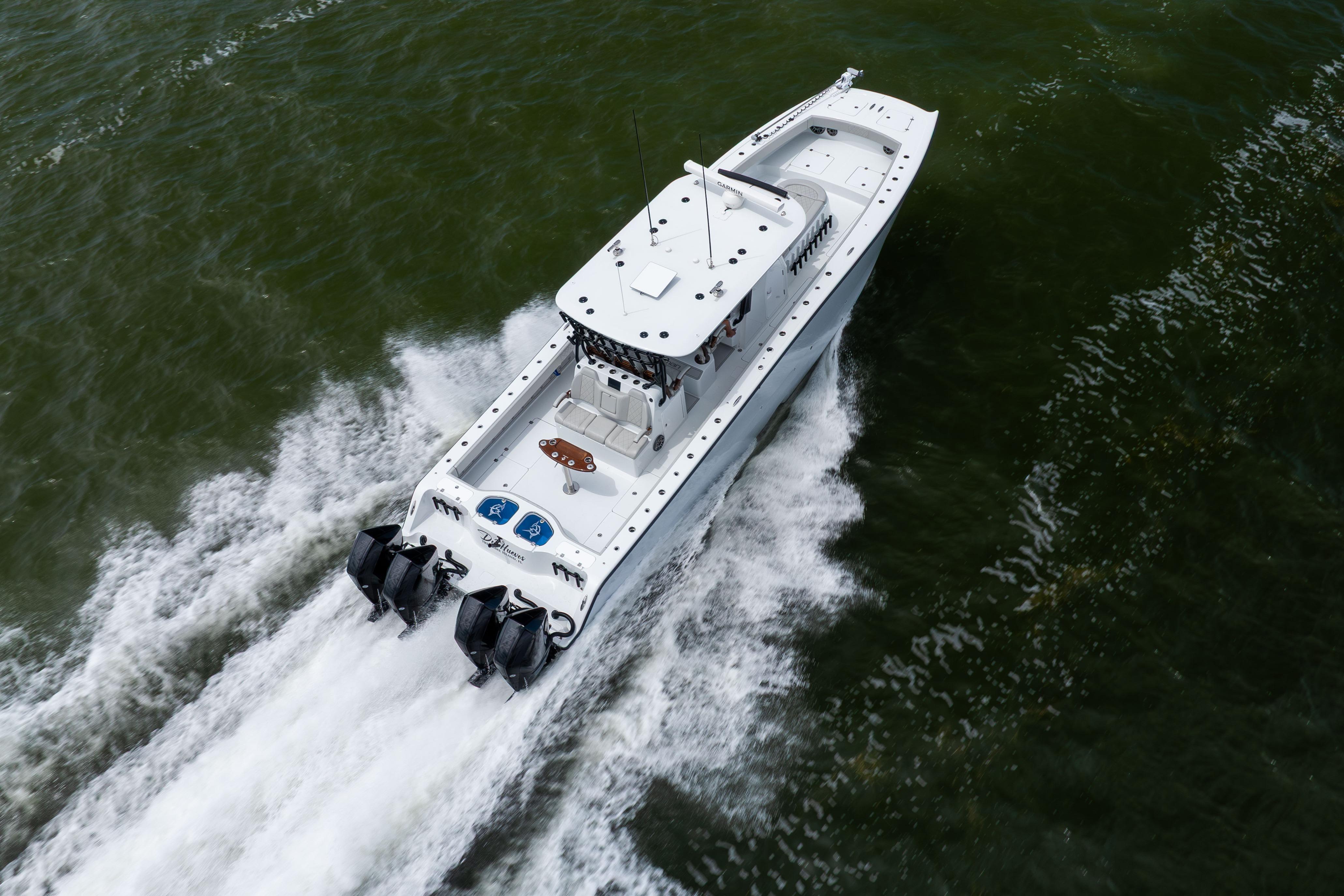 Aerial view of 2025 Freeman 42 LR boat cruising on water.