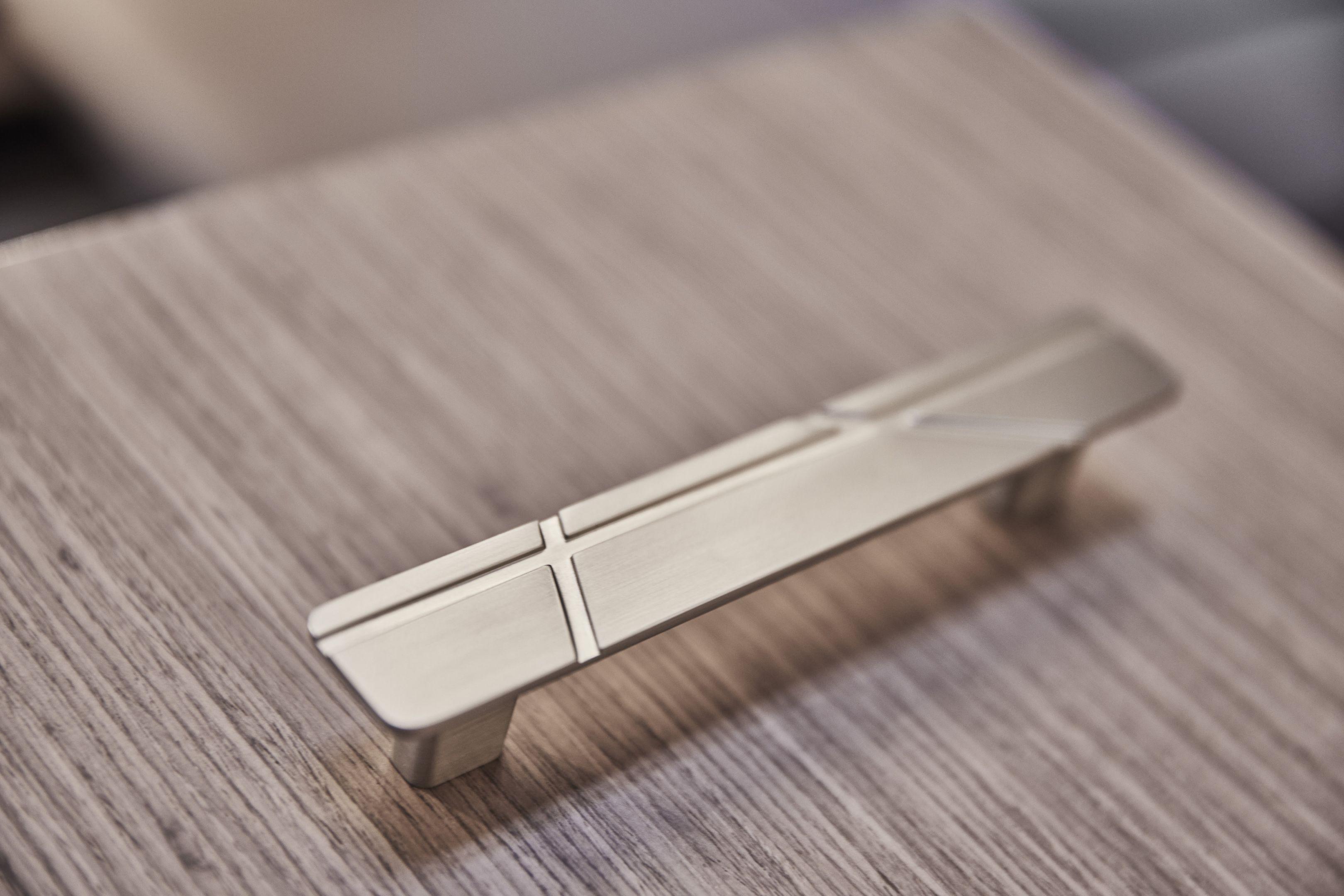 Sleek metallic handle on wooden surface, Prestige X60 model, 2026 design.