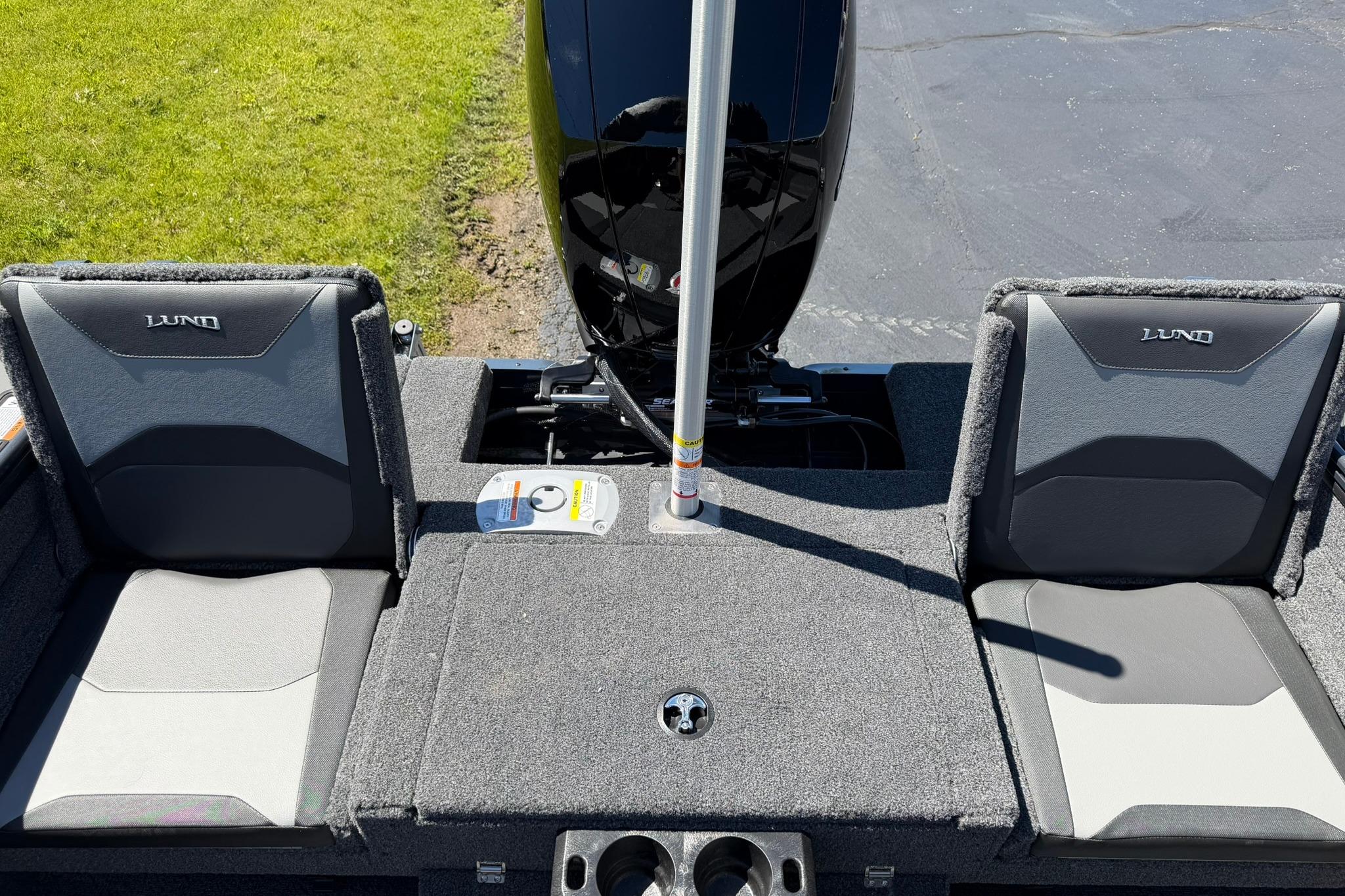 2027 Lund 1775 Crossover XS boat interior with dual seats and motor.