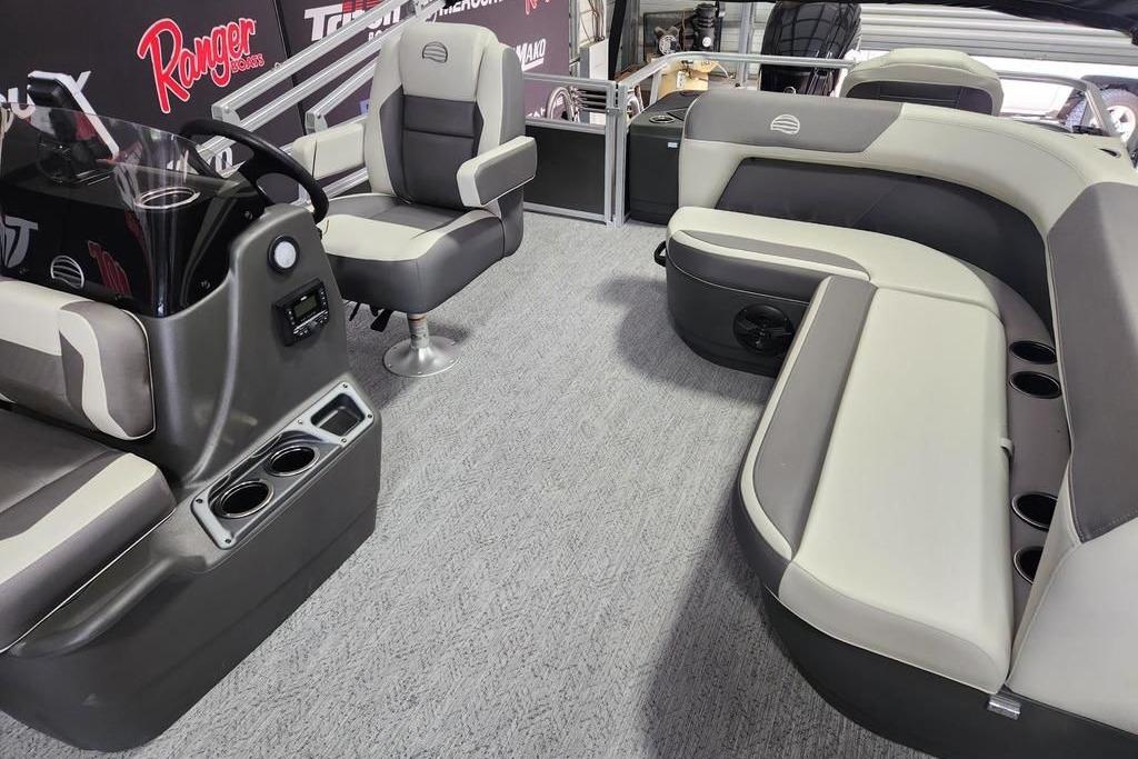 Interior of 2026 Sun Tracker Bass Buggy 18 DLX pontoon boat with seating and helm.