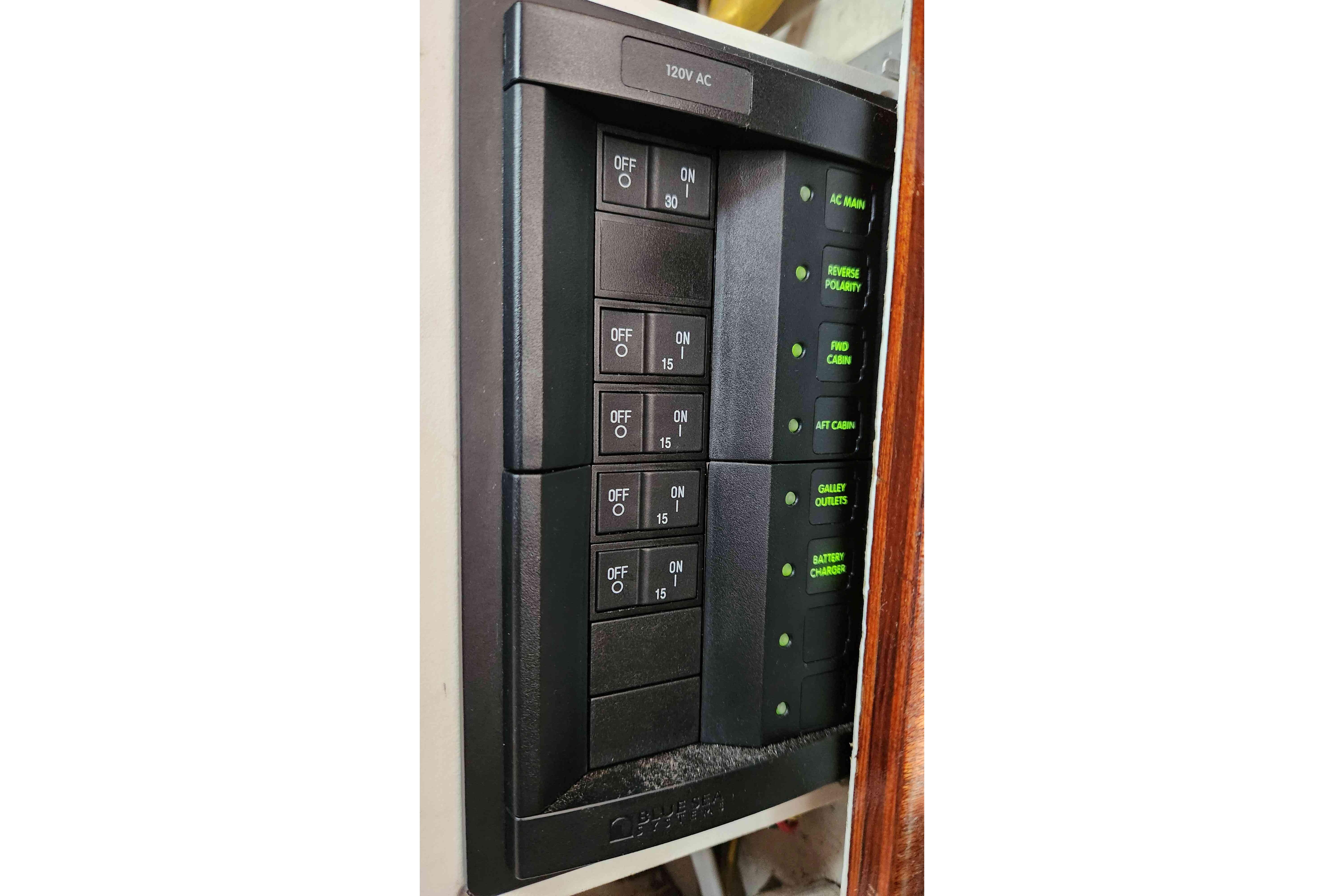 Electrical panel on a 1964 Grandy Tour Boat, featuring labeled switches and indicators.