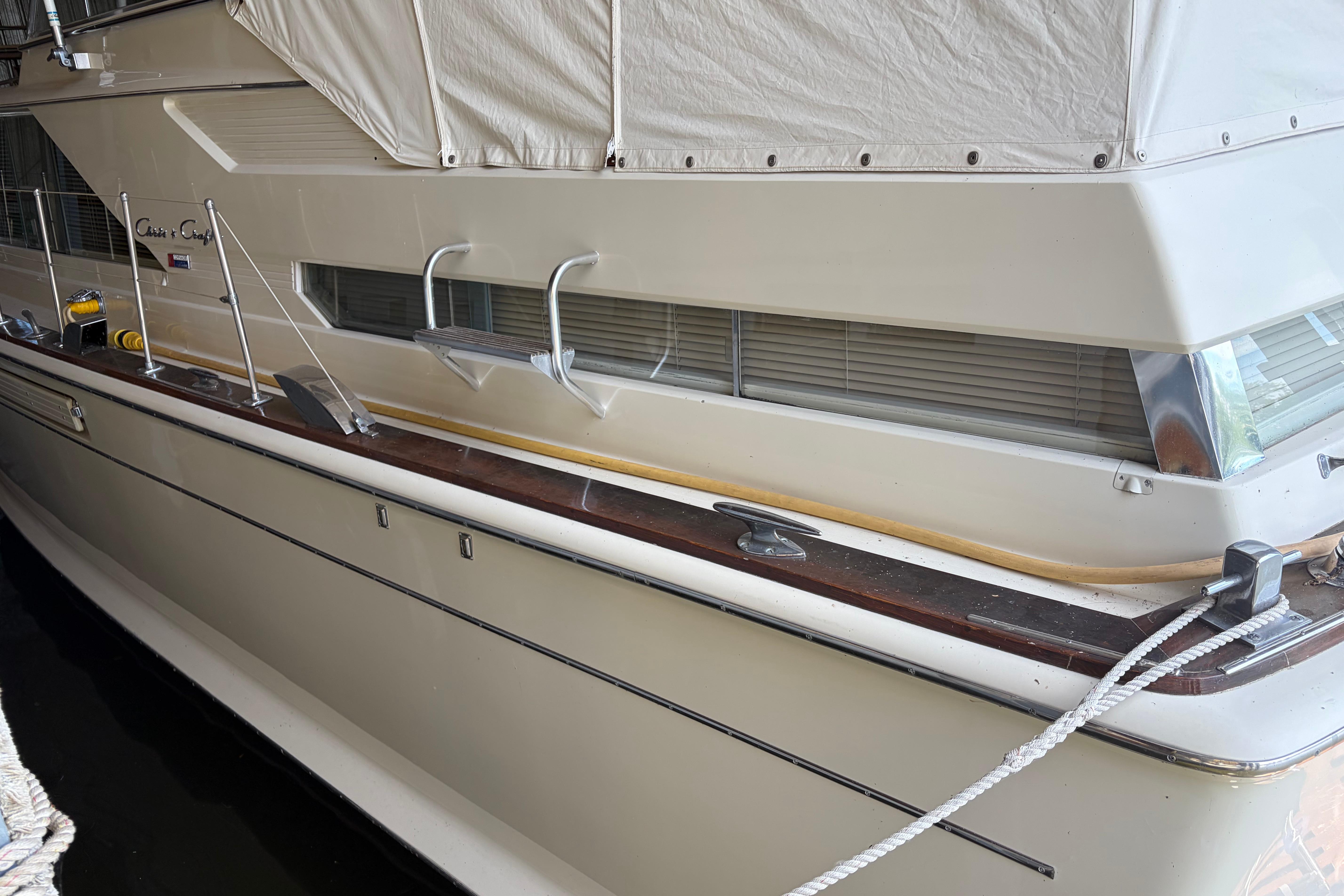 1971 Chris-Craft 42 Commander yacht docked, showcasing classic design and sleek lines.