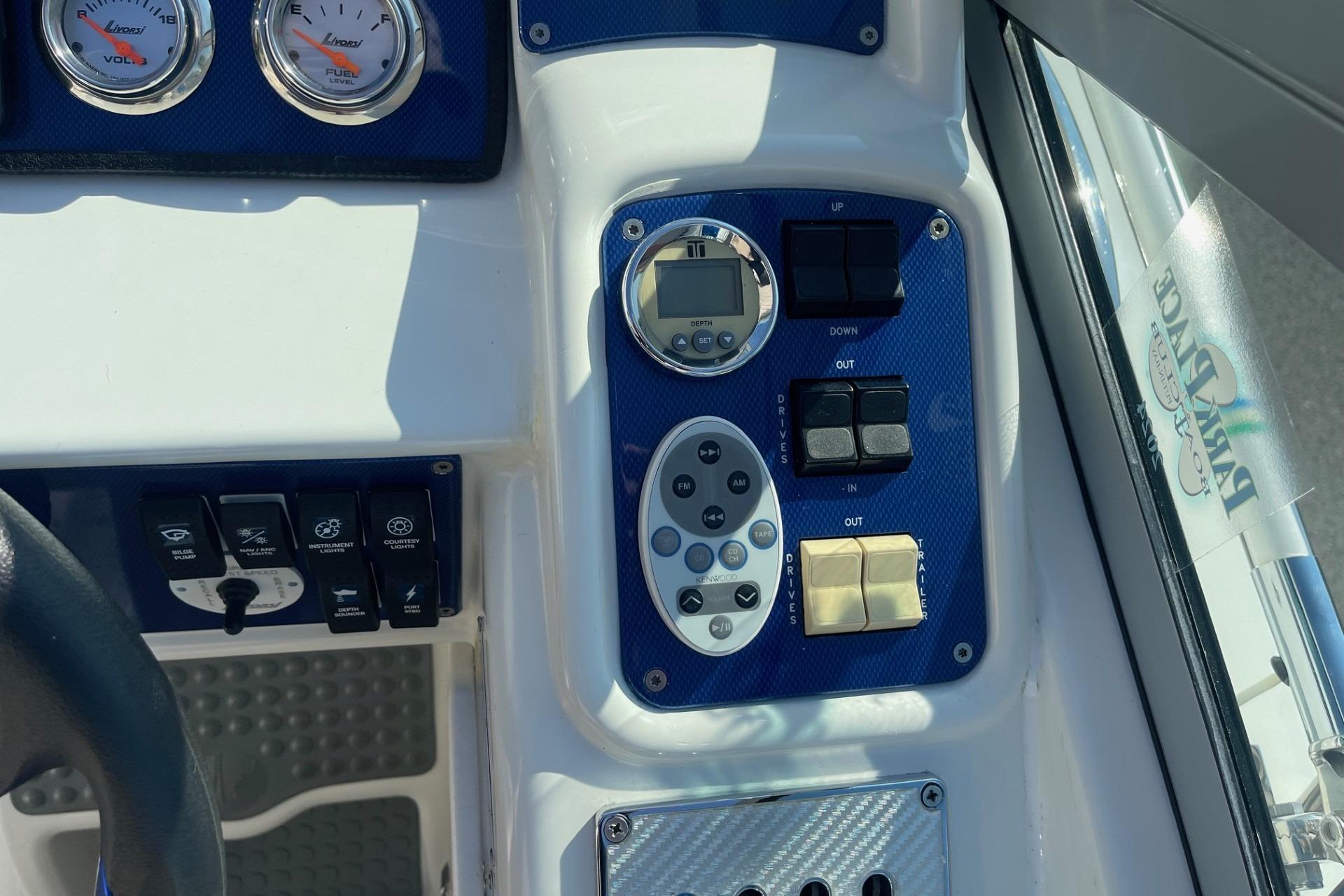 Control panel of a 2004 Formula 382 FASTech boat with gauges and switches.