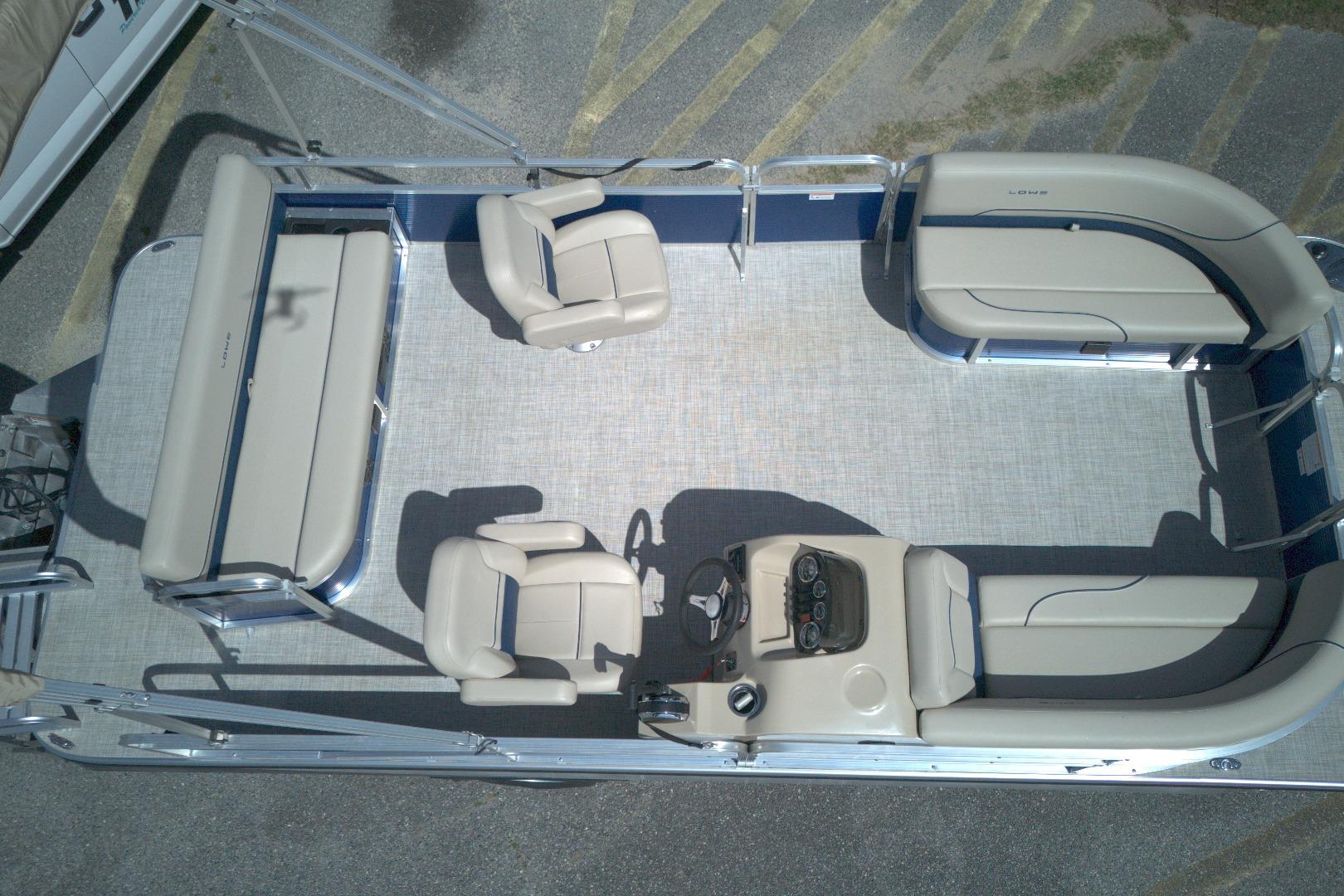2024 Lowe Ultra 200 Cruise pontoon boat interior with seating and helm, aerial view.