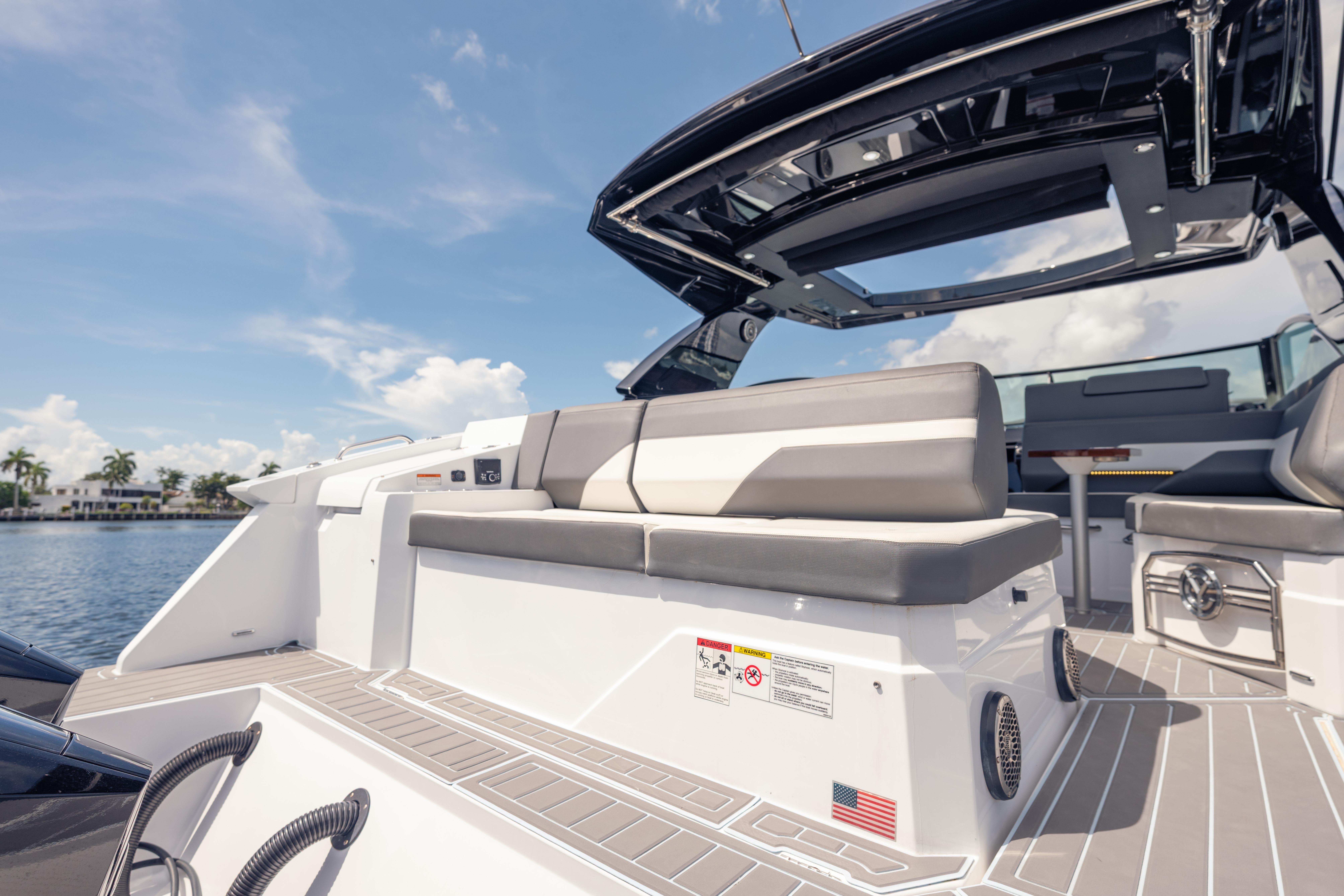 2021 Cruisers Yachts 38 GLS luxury boat interior with seating and open sky view.
