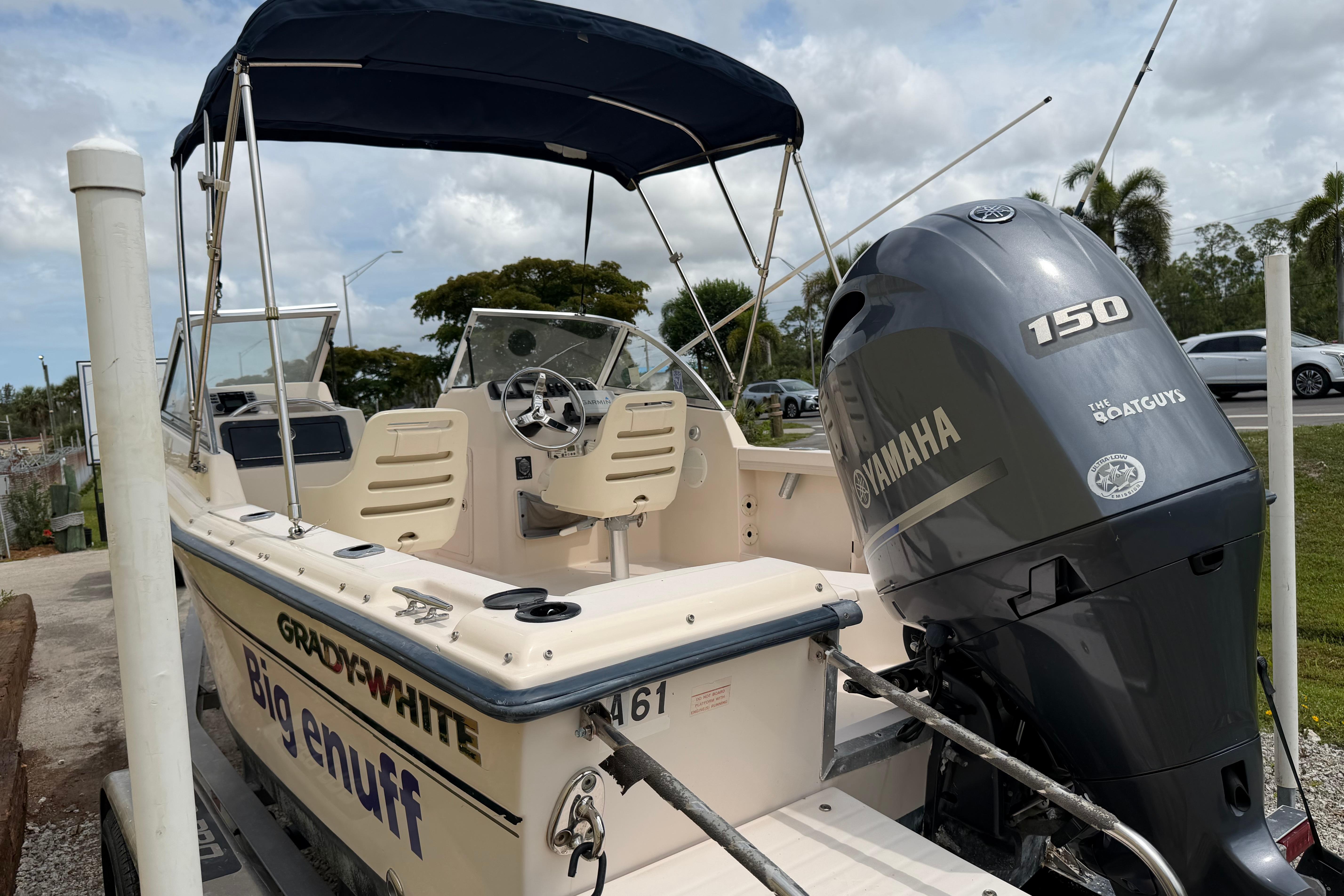 2006 Grady-White Tournament 185 boat with Yamaha 150 engine, parked outdoors.