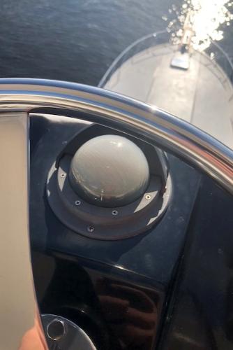Close-up of the helm on a 1997 Bertram Convertible boat.