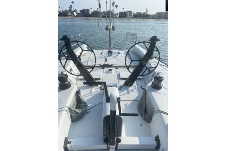 Dual steering wheels on a 2000 Andrews 63 yacht, docked by the waterfront.