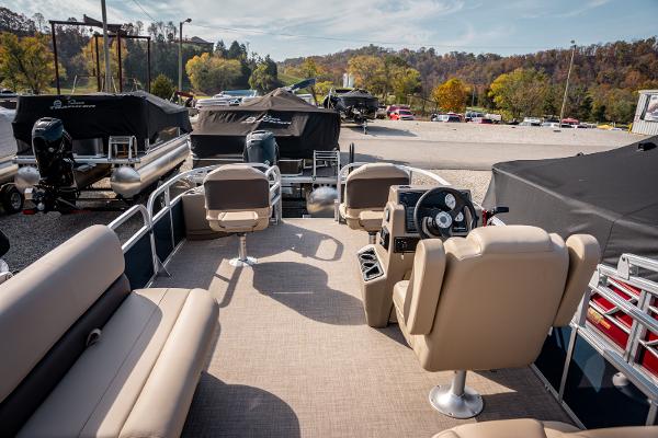 2025 Sun Tracker BASS BUGGY 18 pontoon boat interior with seating and steering console.
