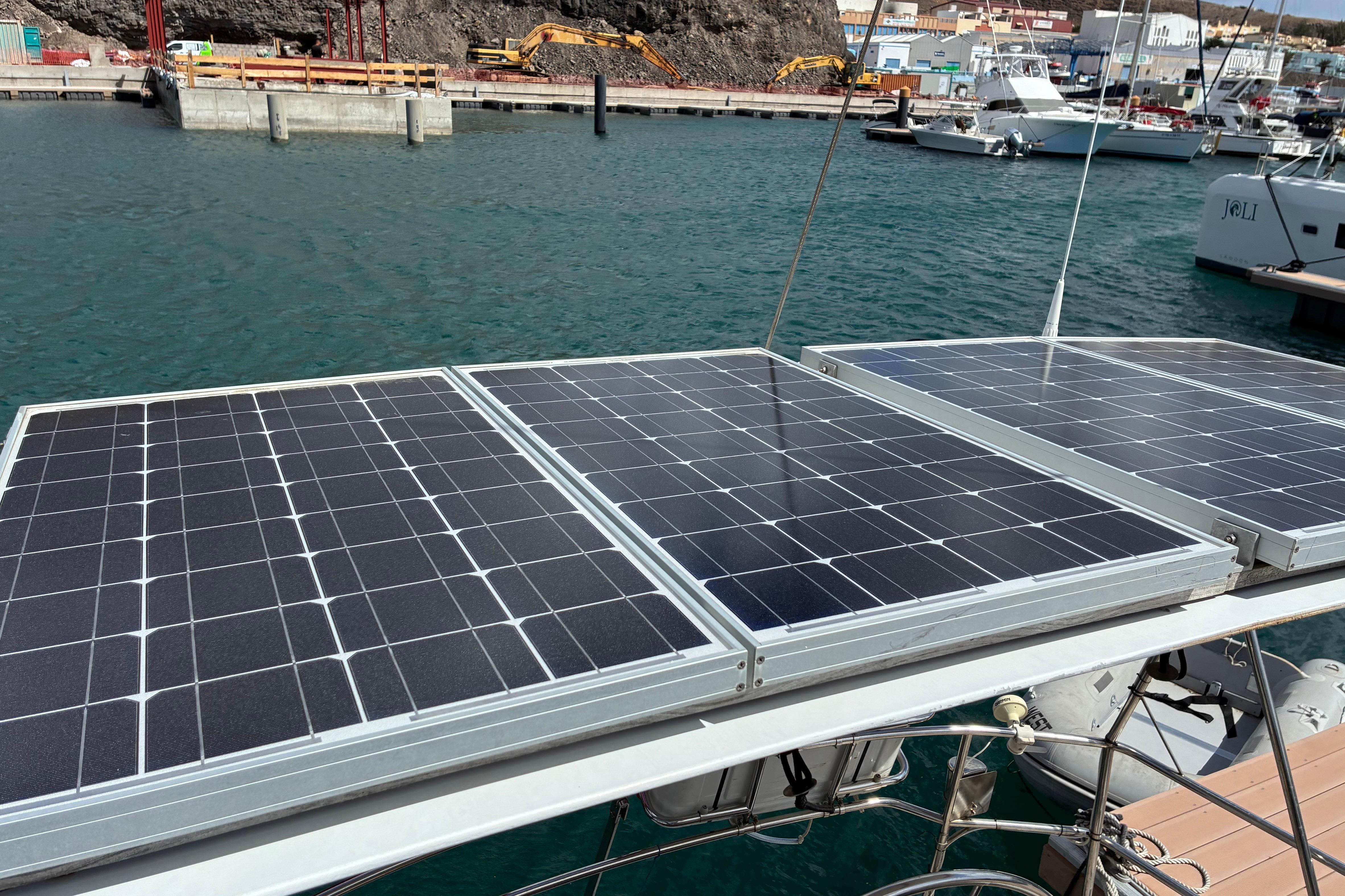 Solar panels on a 1989 Sweden Yachts 340, docked in a marina.