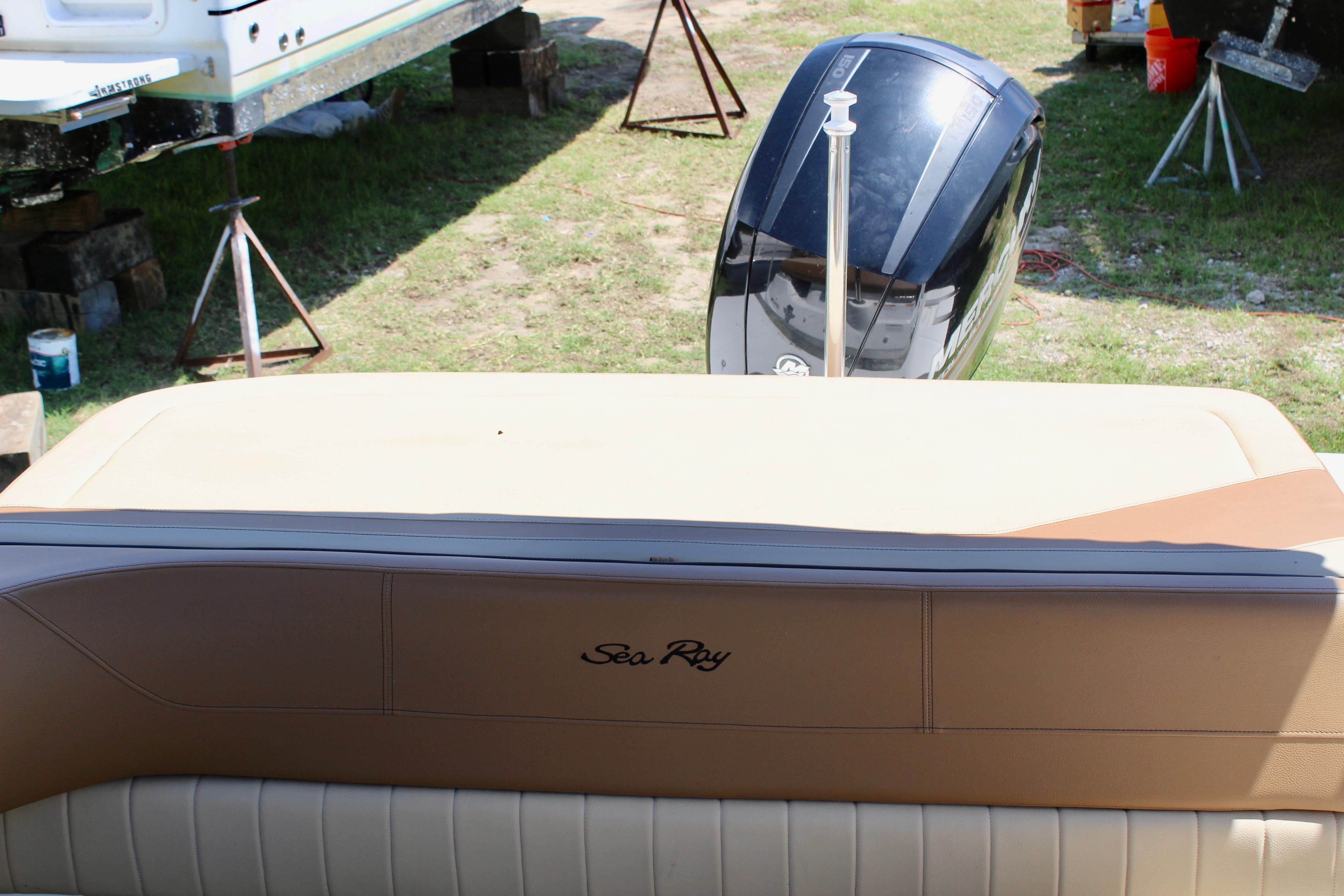 2018 Sea Ray SPX 190 Outboard boat interior with visible engine and seating.