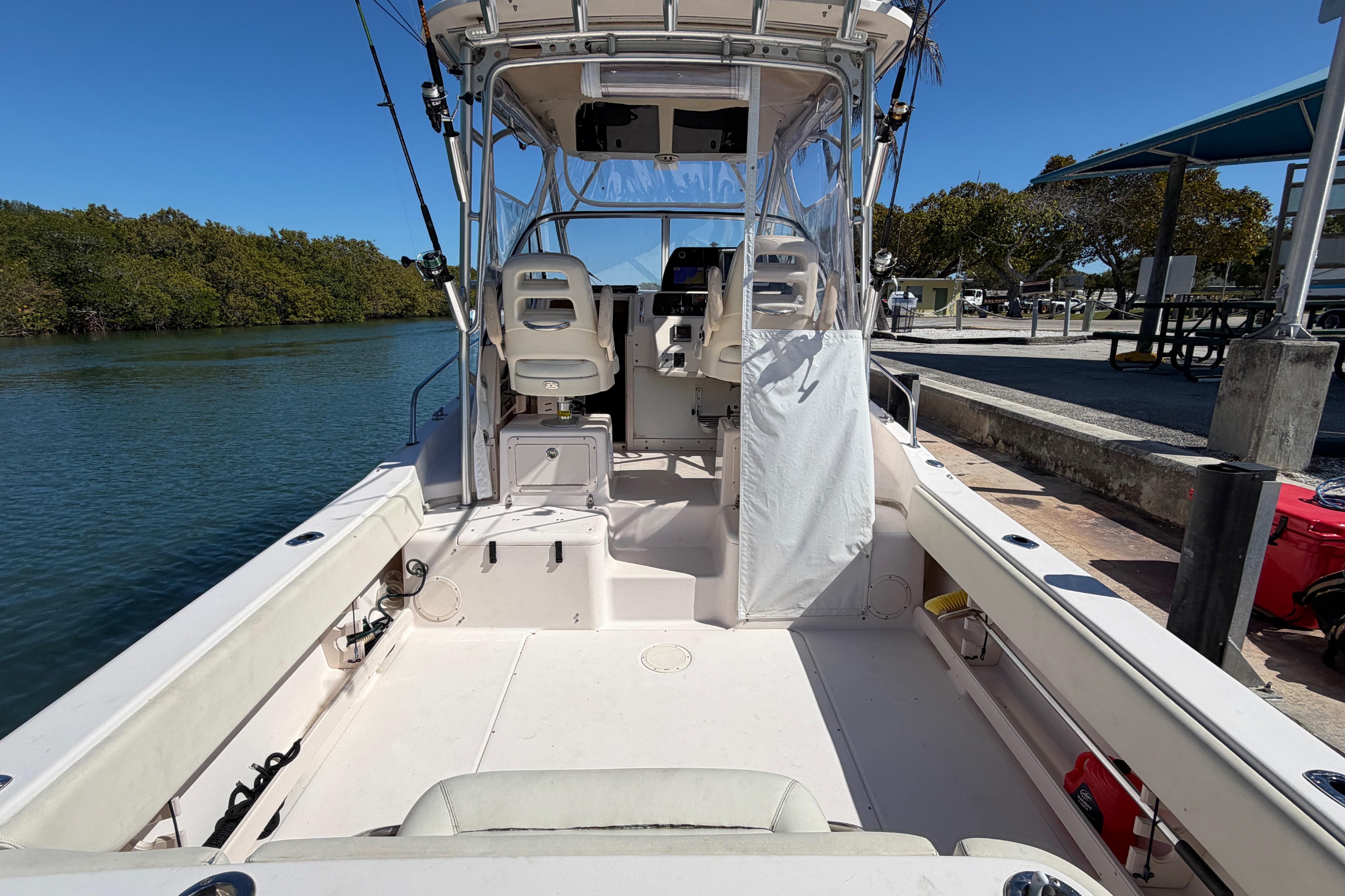 2006 Grady-White Sailfish 282 boat docked, showcasing spacious deck and seating area.