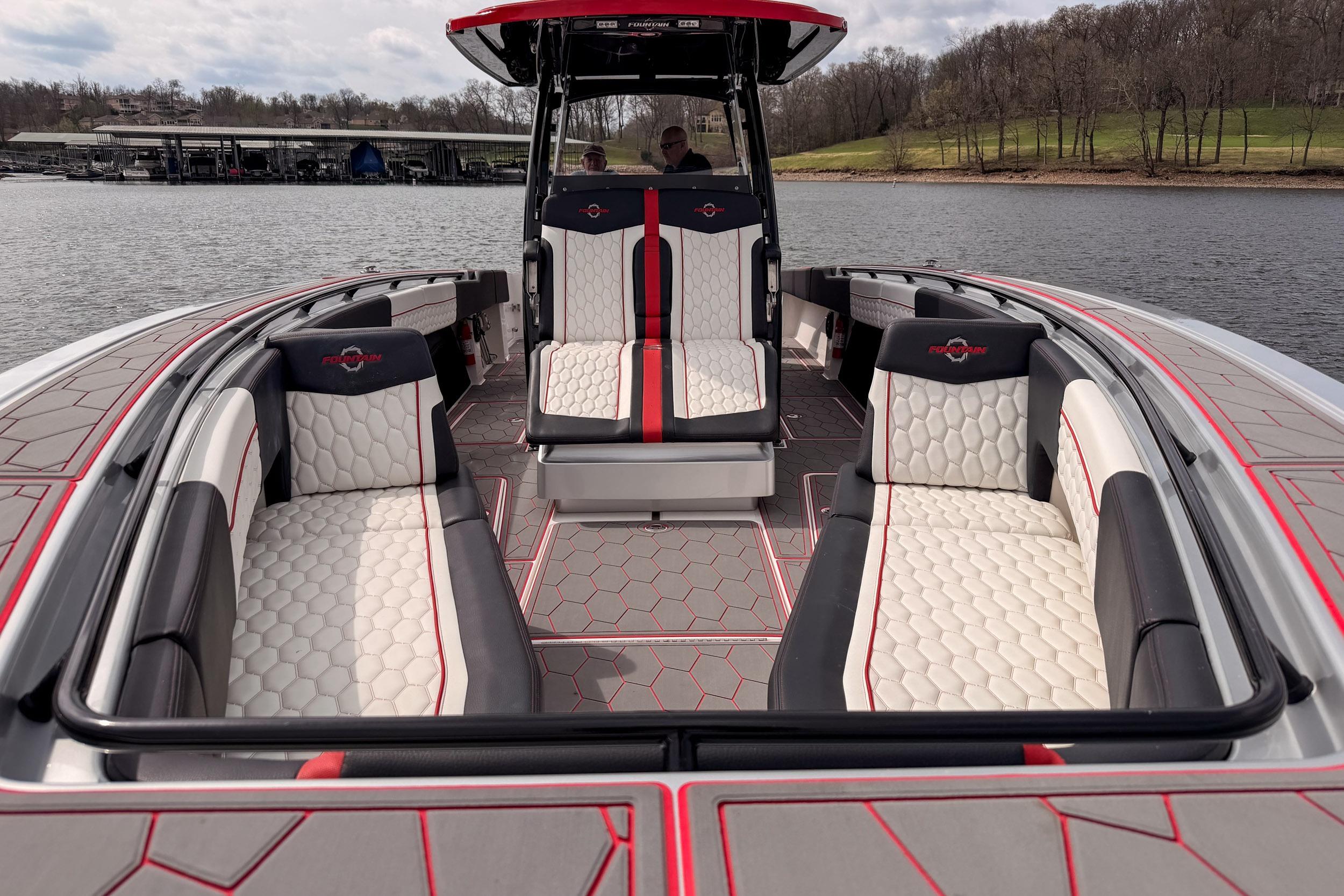 2021 Fountain 38 SC boat interior with stylish seating and modern design on a lake.