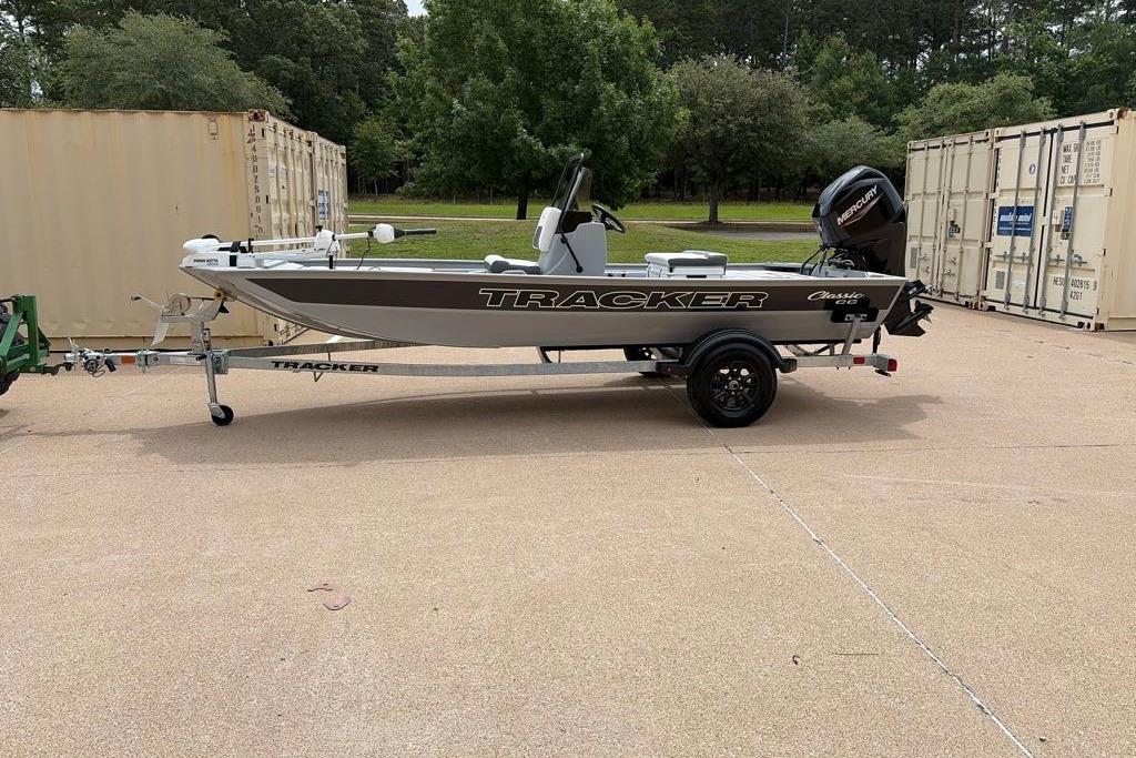 2026 Tracker Bass Tracker Classic CC boat on trailer, parked outdoors.