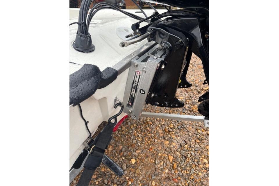 2026 Mako Pro Skiff 17 CC boat engine mount on gravel surface.